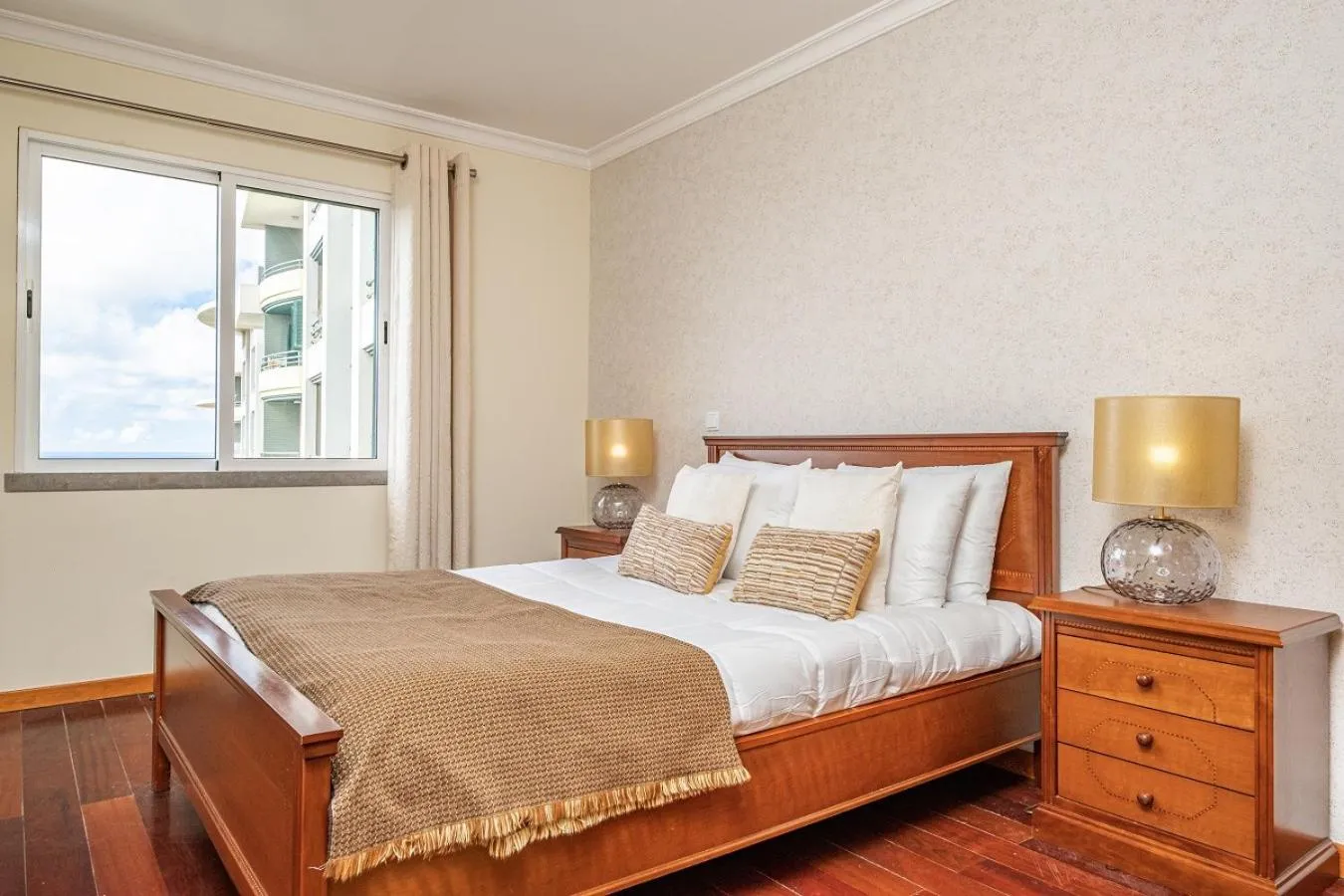 Bed in Bellemar Apartment by Homie
