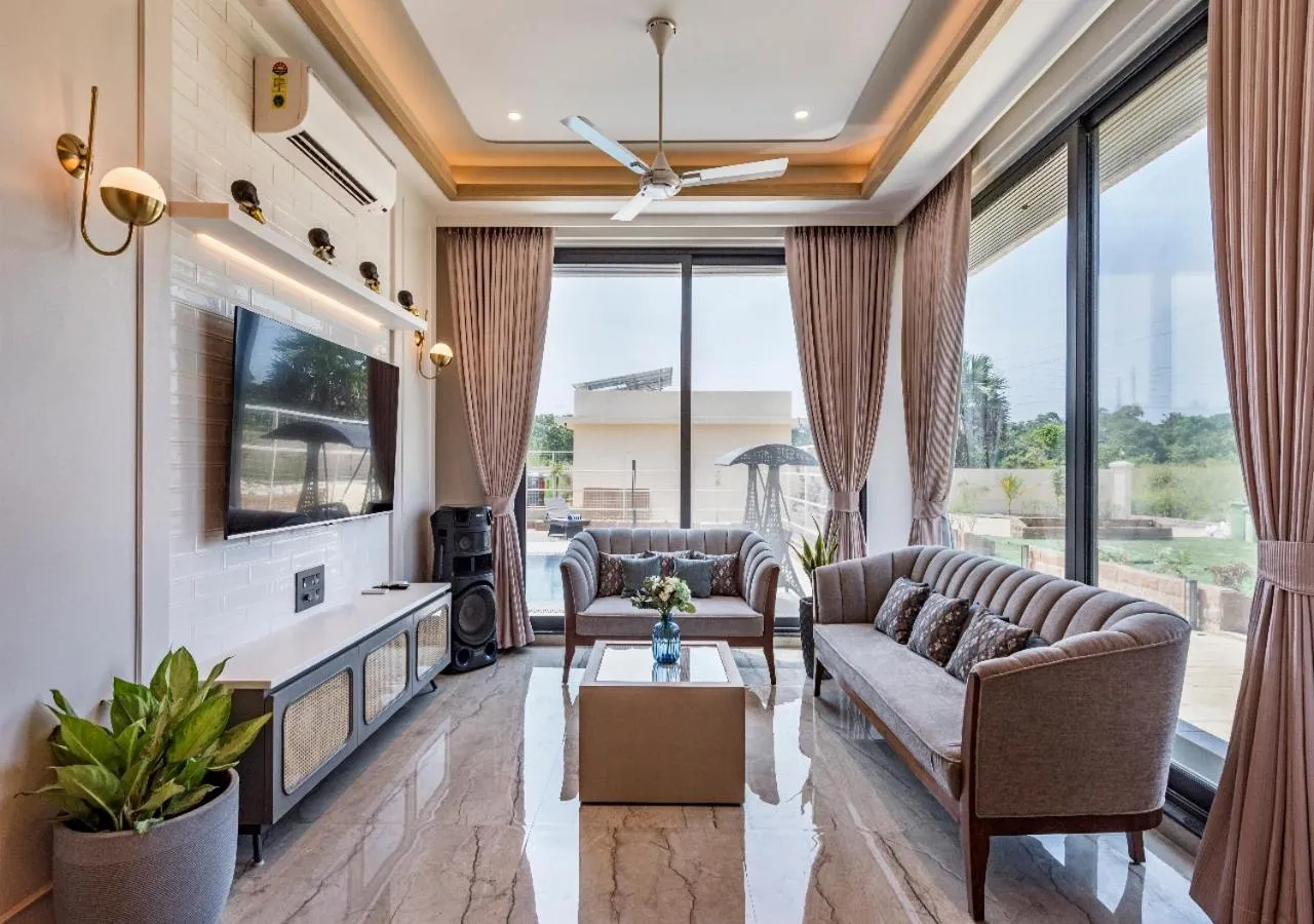 TV and multimedia in SaffronStays Nishta - 4BR pet-friendly villa with pool, turf, gazebo & terrace BBQ views in Alibaug