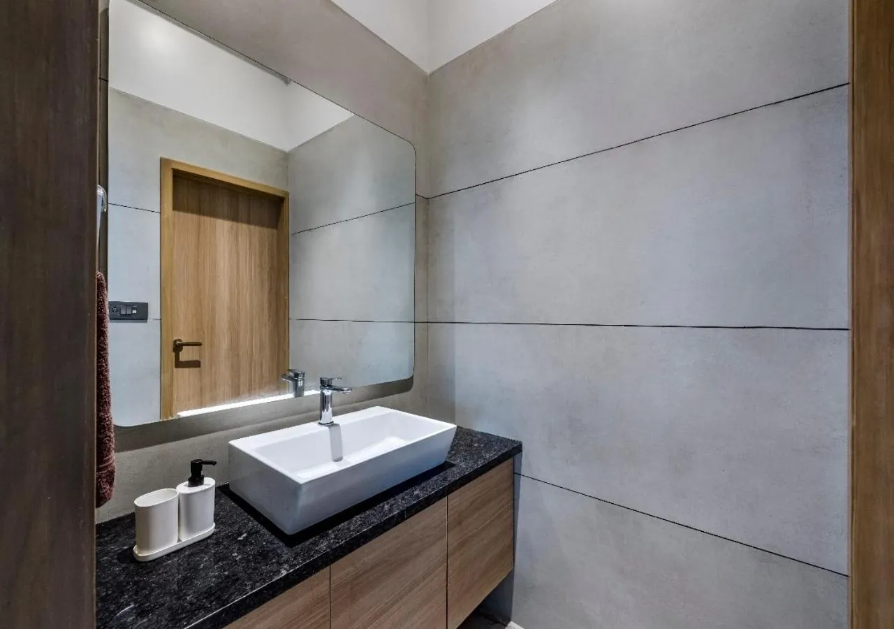 Bathroom in SaffronStays Nishta - 4BR pet-friendly villa with pool, turf, gazebo & terrace BBQ views in Alibaug