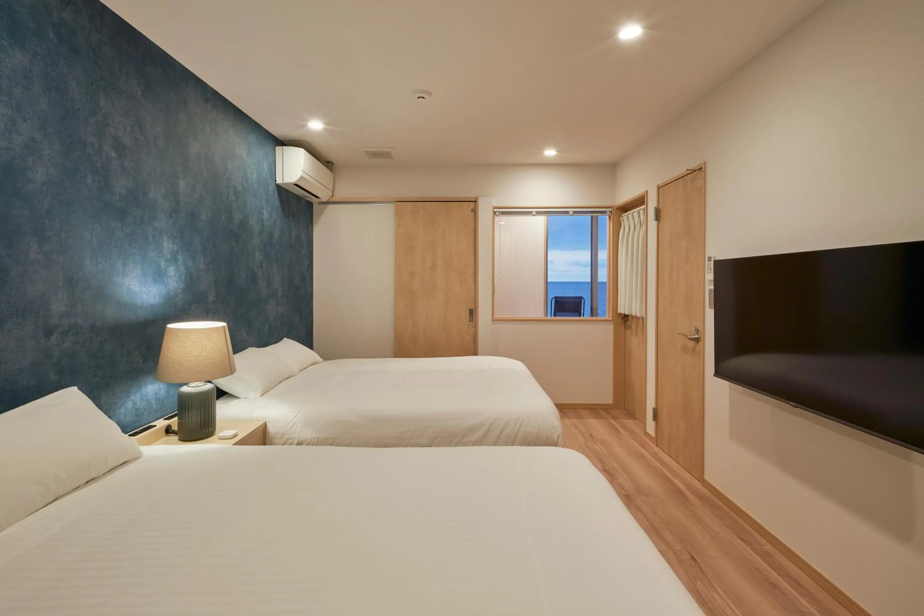 Bed in ALFACIO RESORT STAY ITOSHIMA