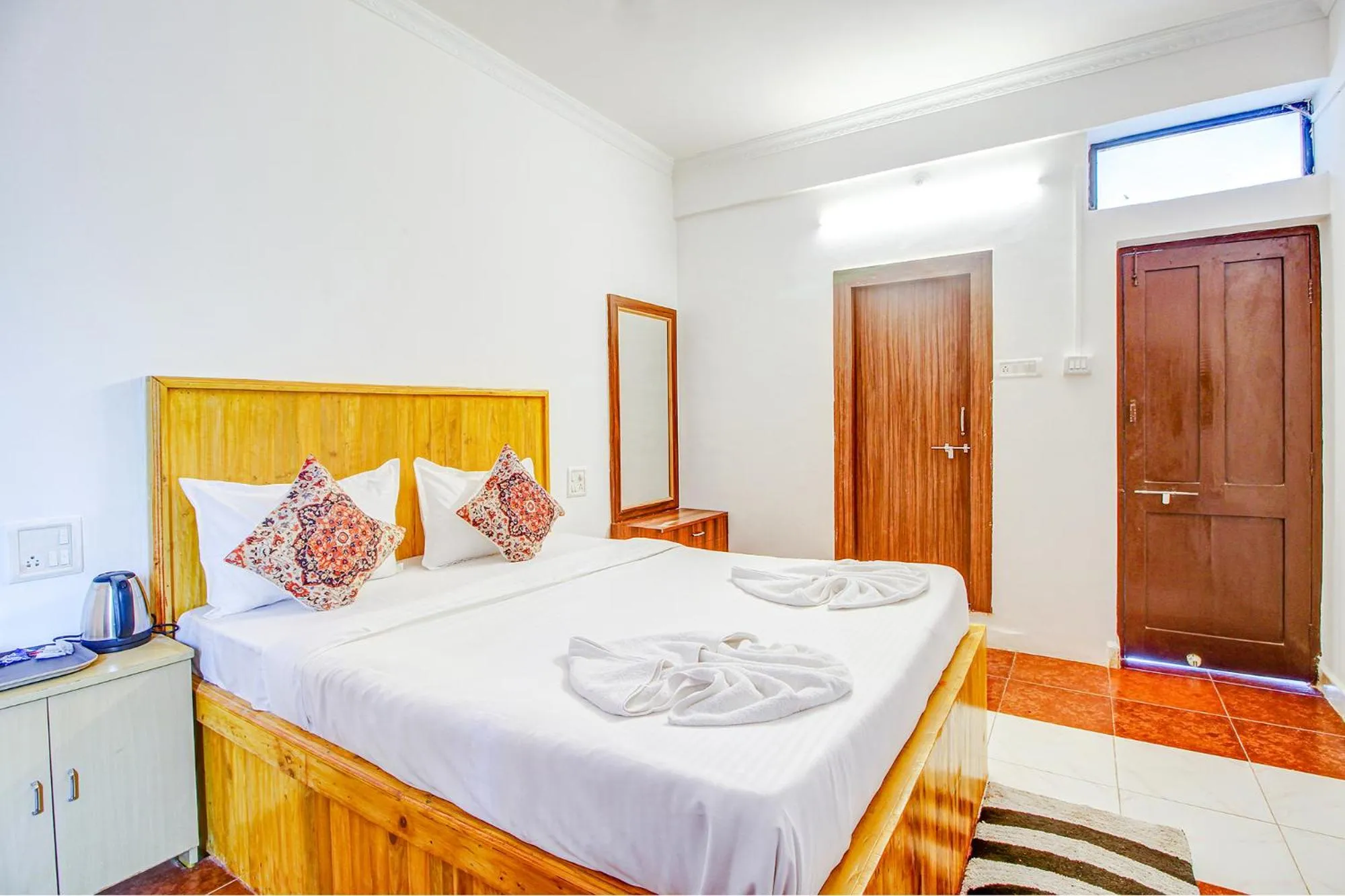 Bed in FabHotel Pleasure Inn