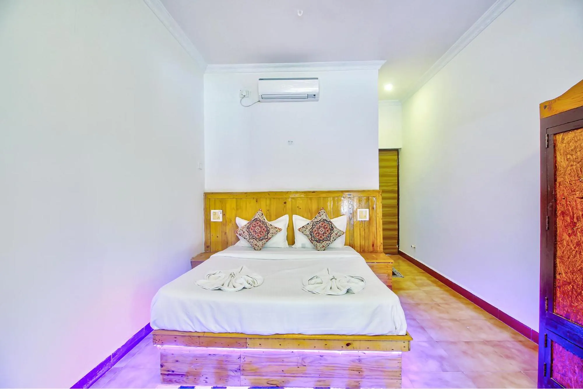 Bed in FabHotel Pleasure Inn