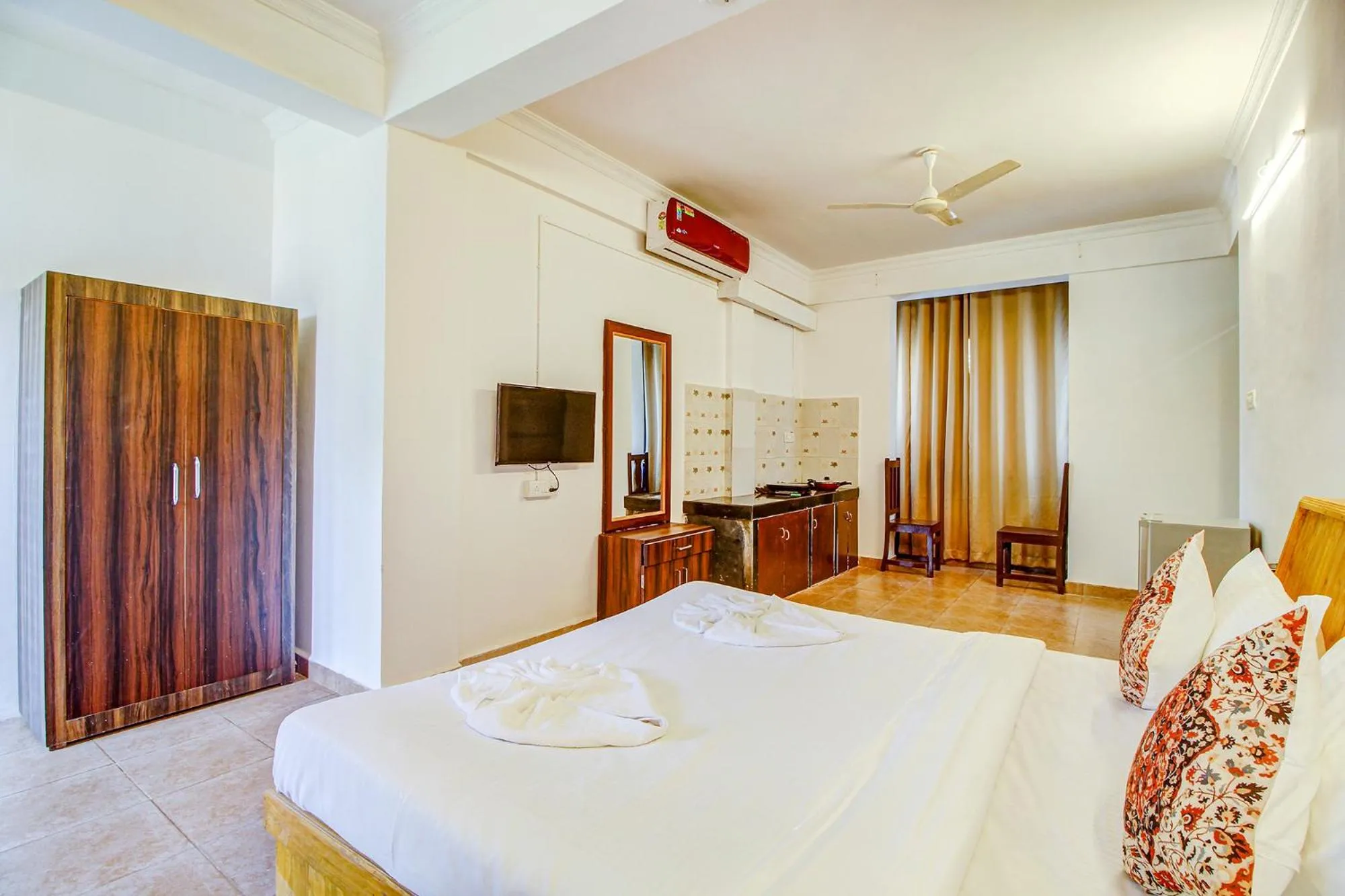 Bed in FabHotel Pleasure Inn