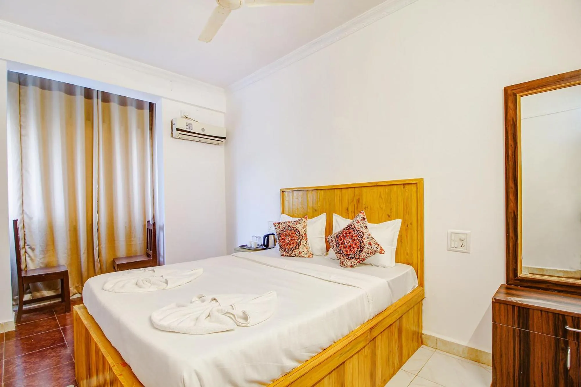 Bed in FabHotel Pleasure Inn