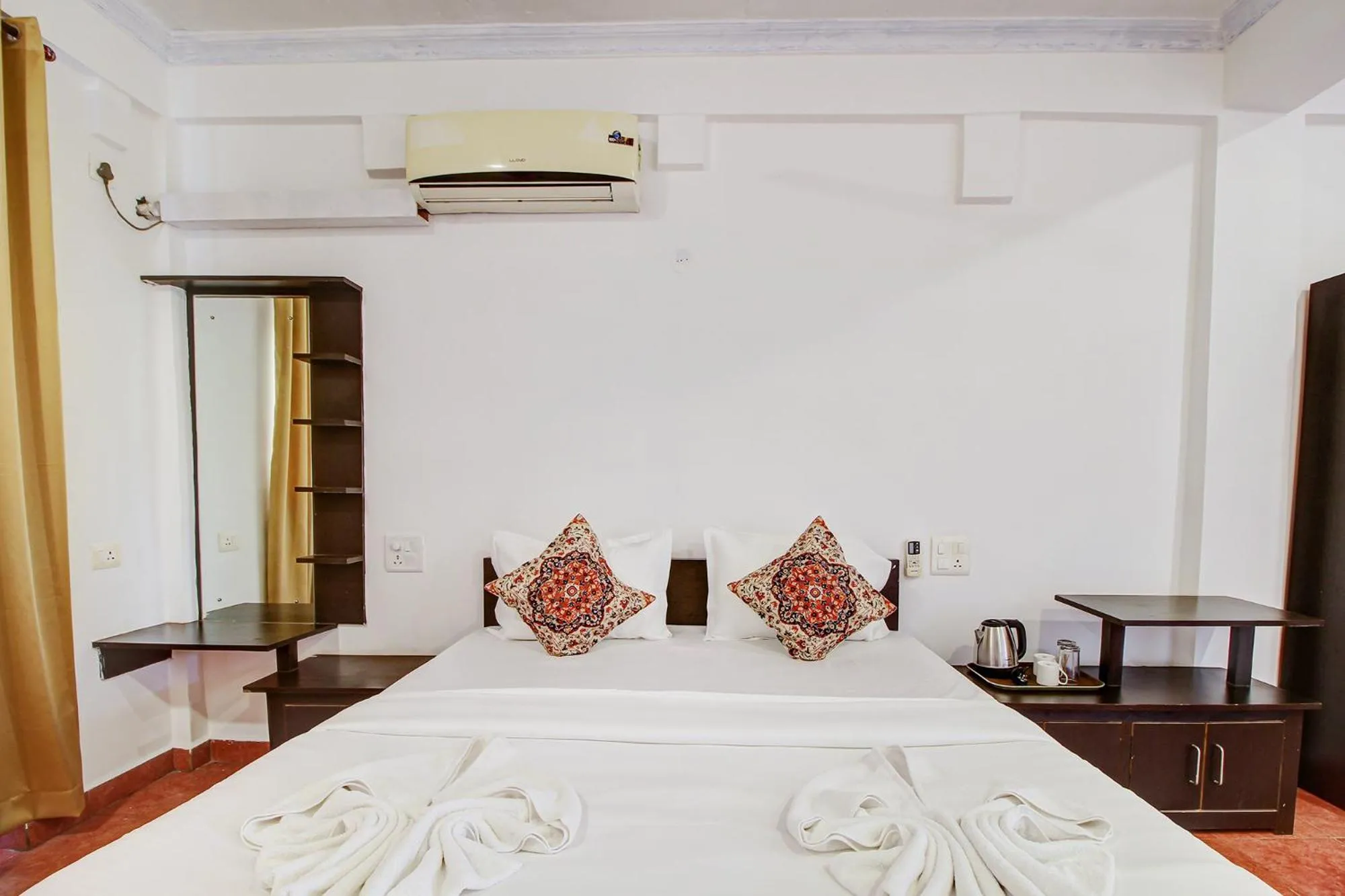 Bed in FabHotel Pleasure Inn