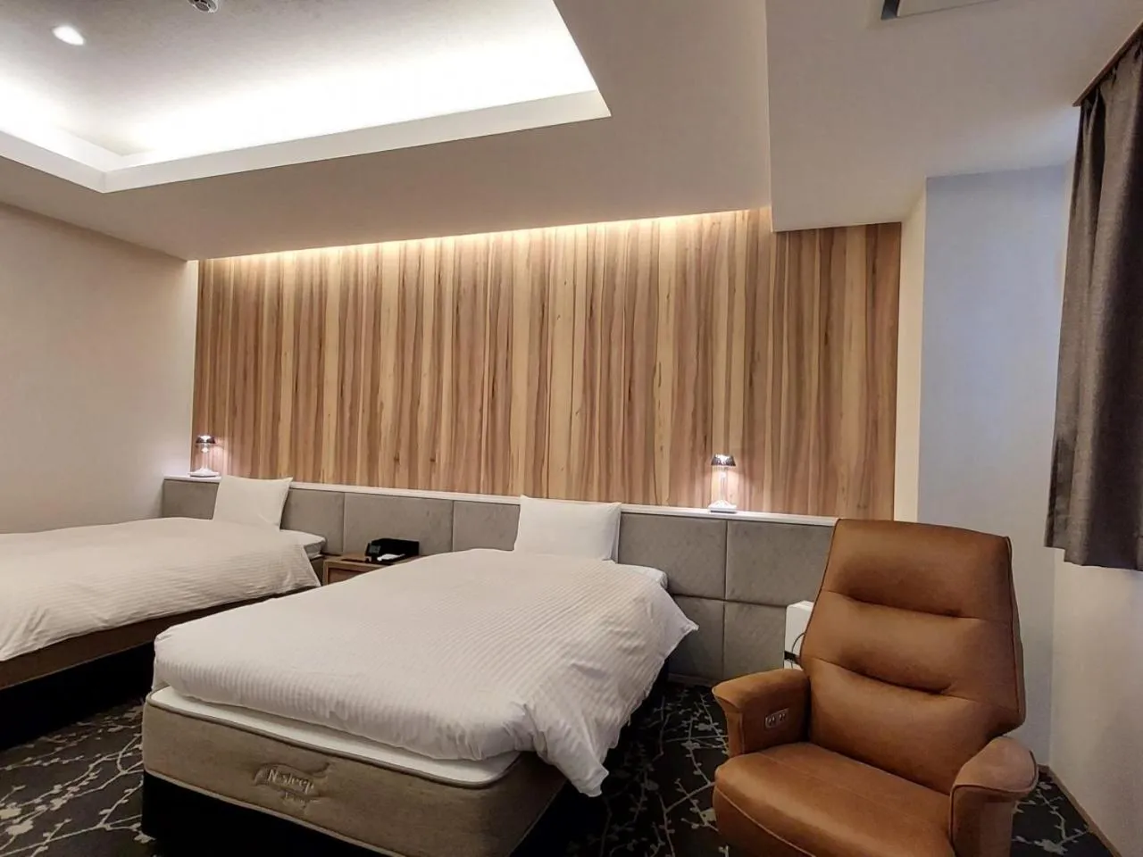 Bed in The Legato Inn MIFUNE