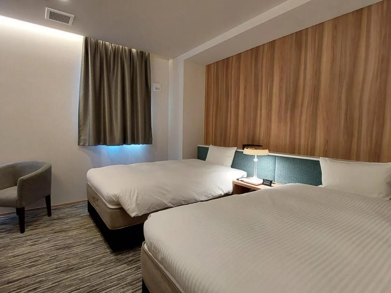 Bed in The Legato Inn MIFUNE