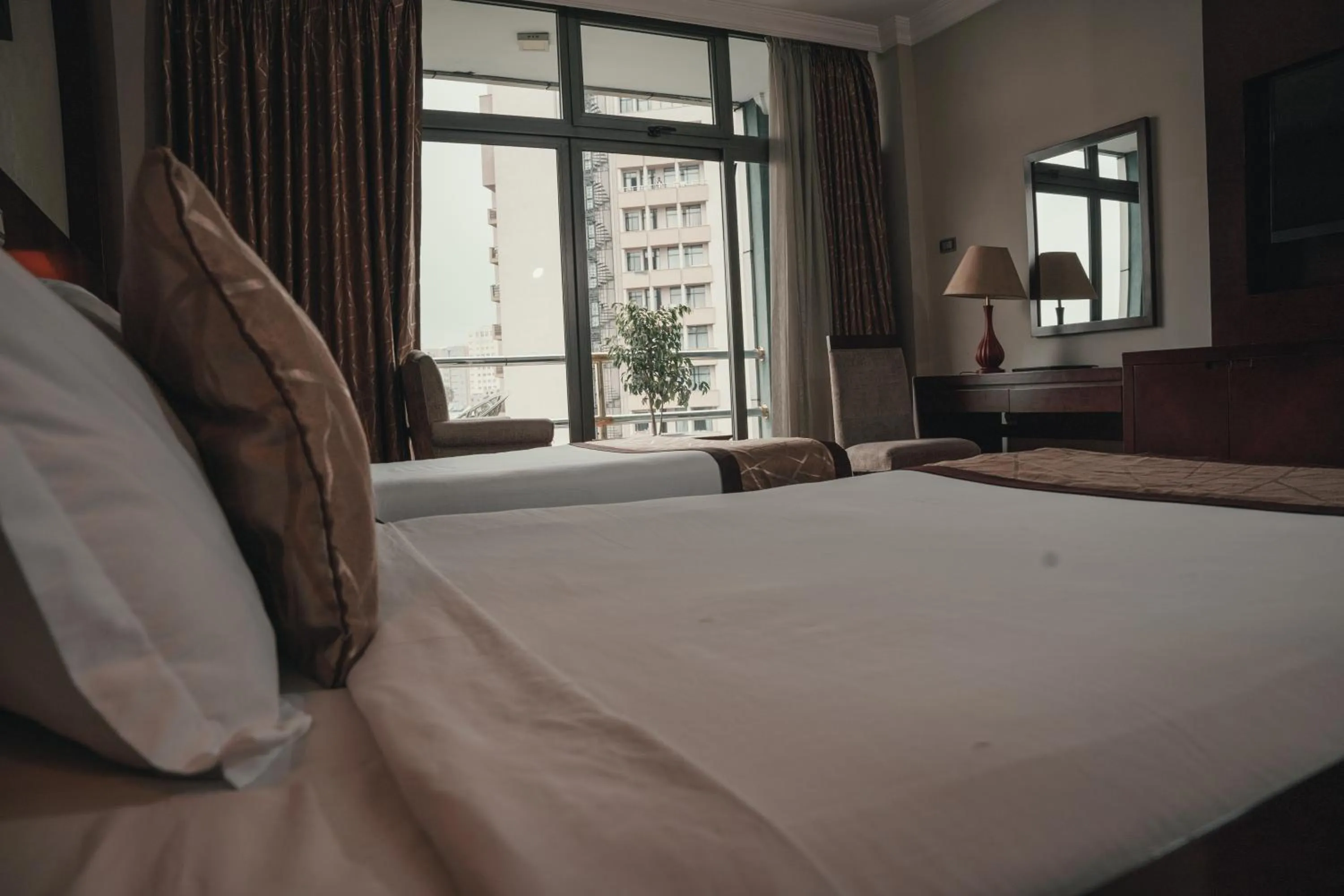 Bed in Sidra International Hotel