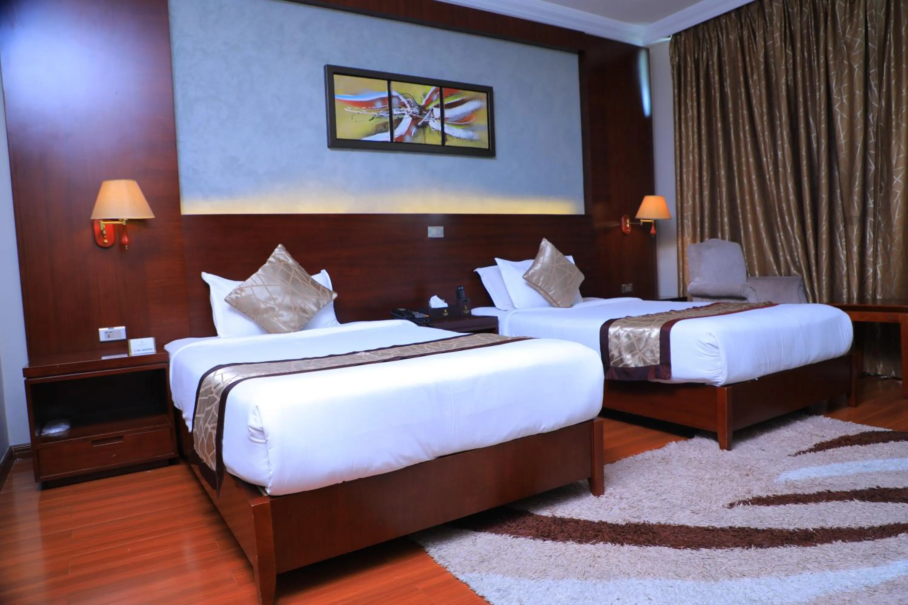 Bed in Sidra International Hotel