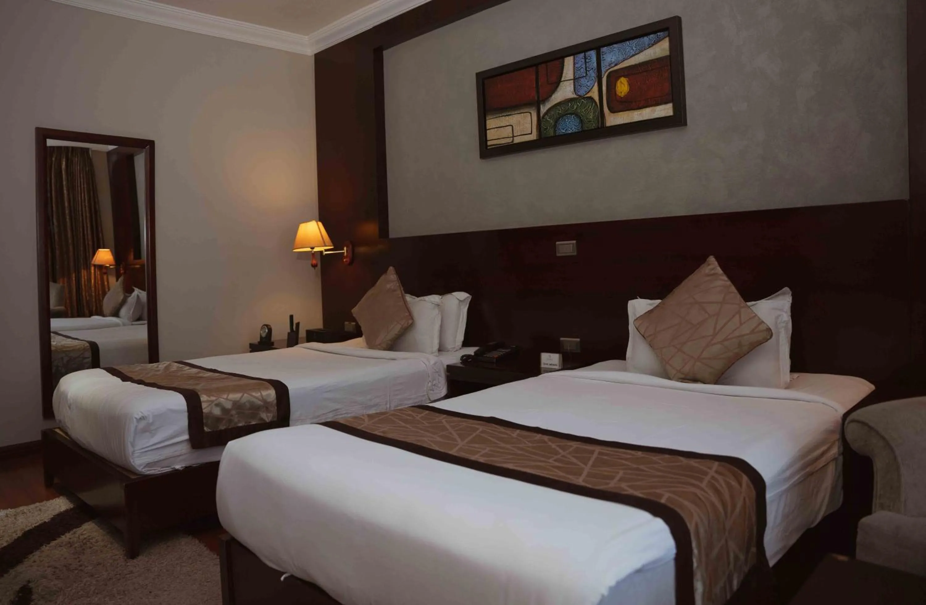 Bed in Sidra International Hotel
