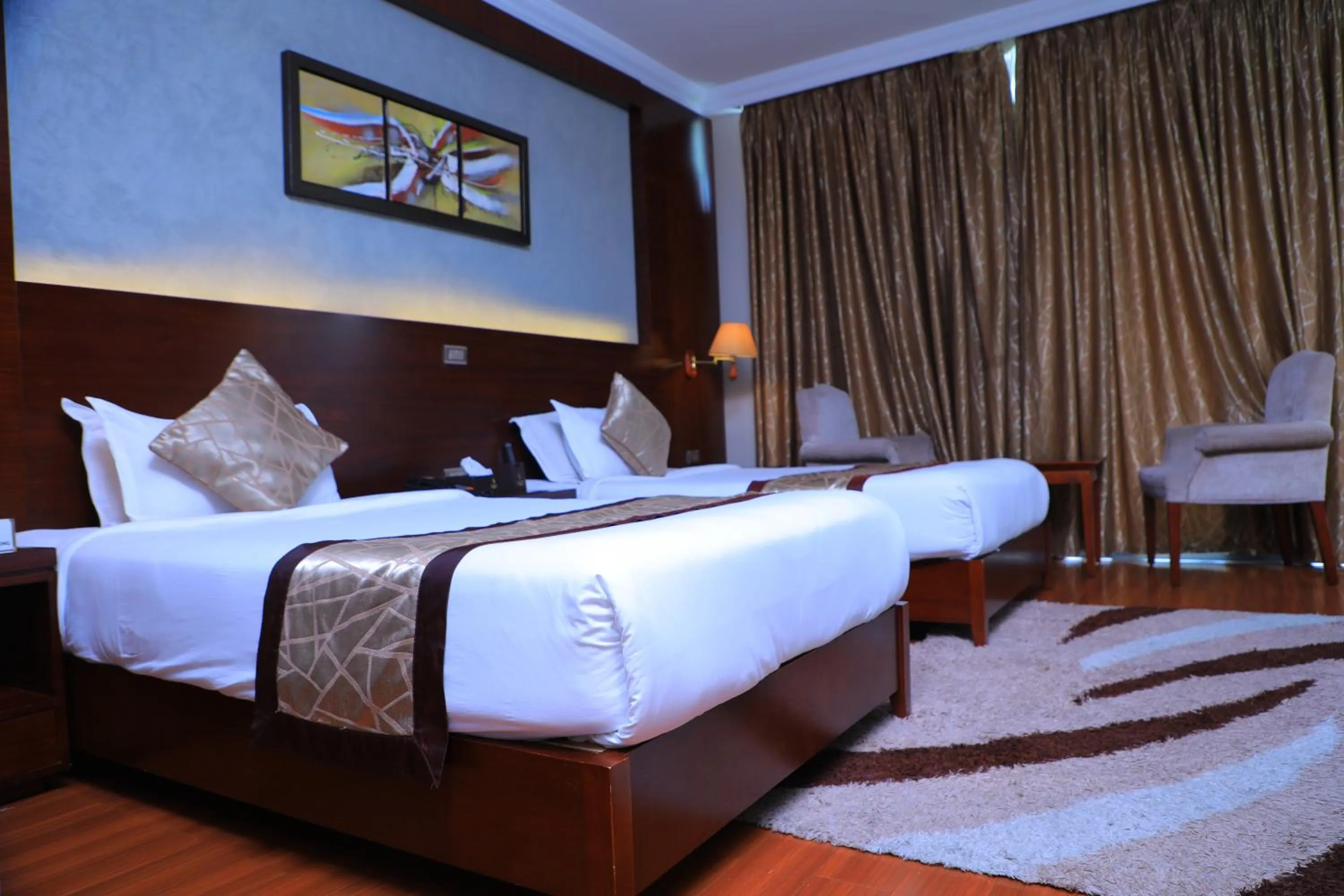 Bed in Sidra International Hotel