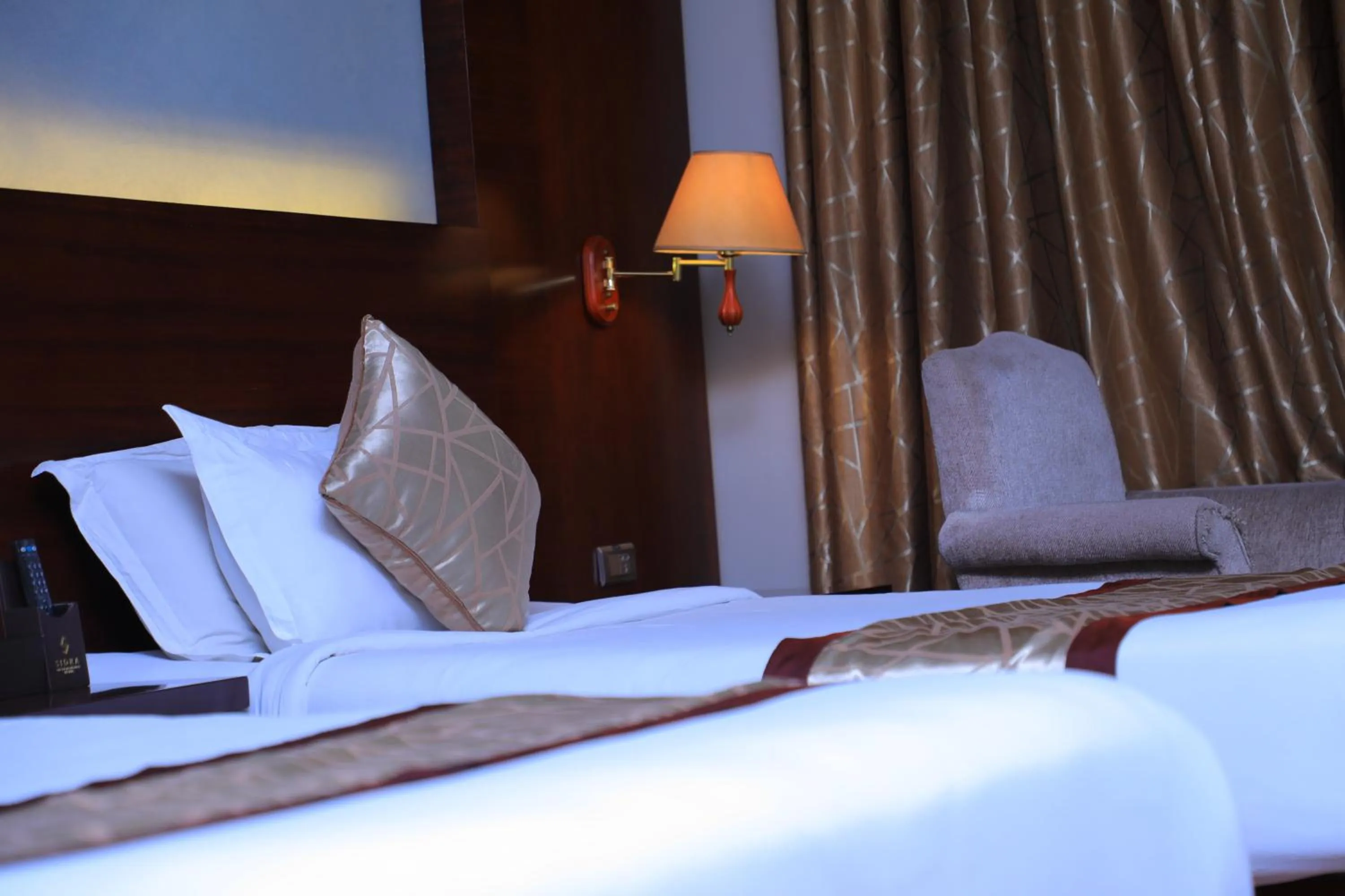 Bed in Sidra International Hotel