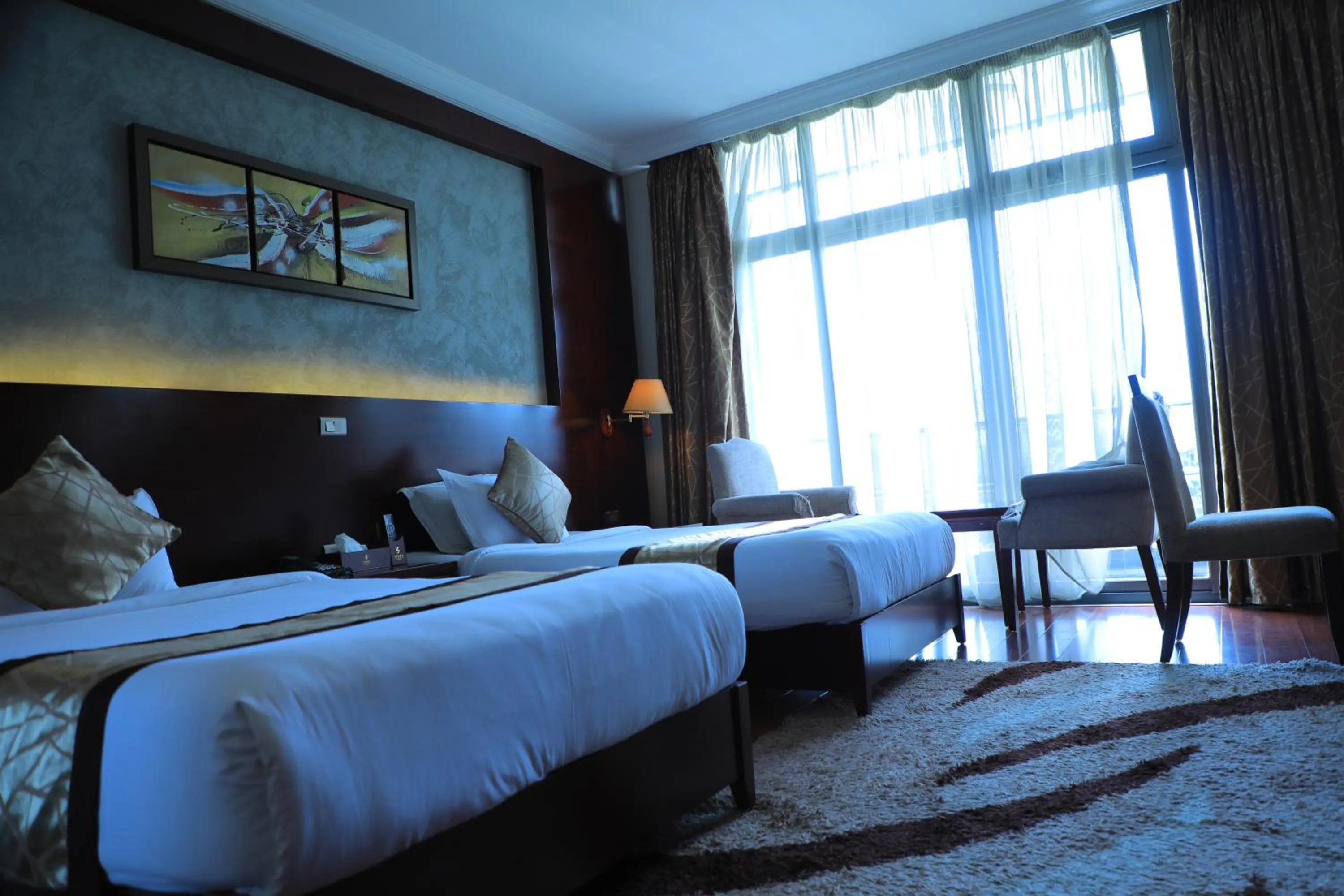 Bed in Sidra International Hotel