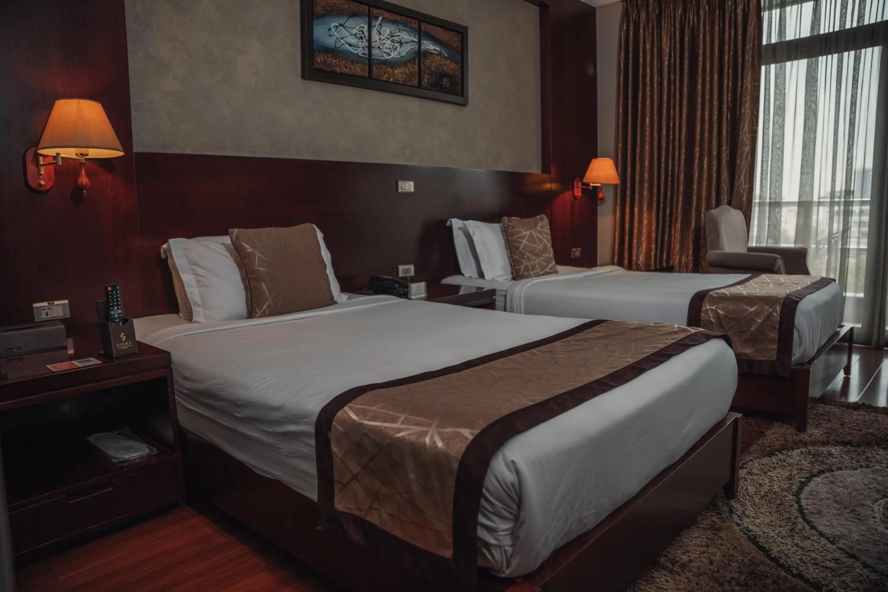 Bed in Sidra International Hotel