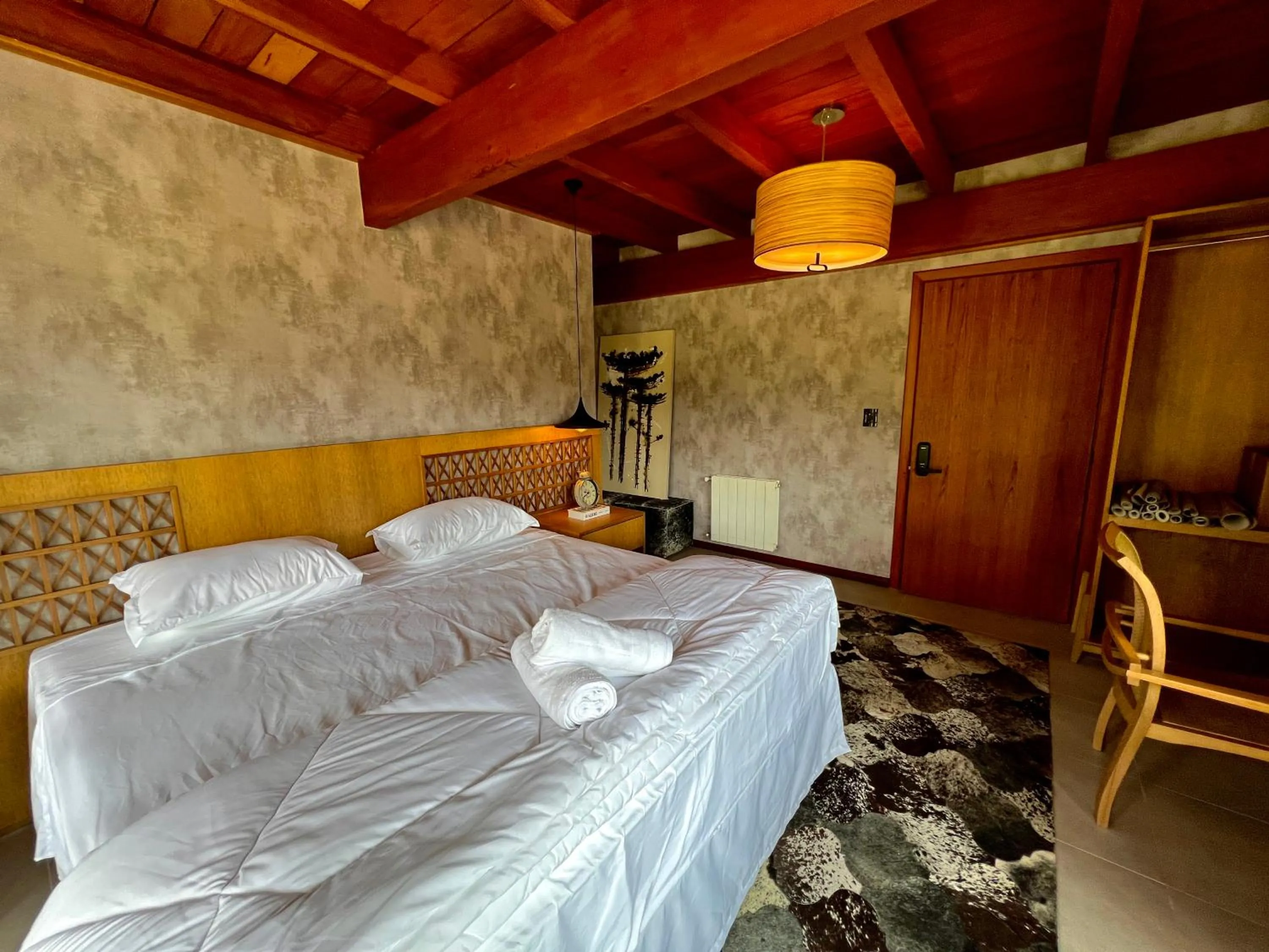 Bed in WoodStone Hotel Fazenda