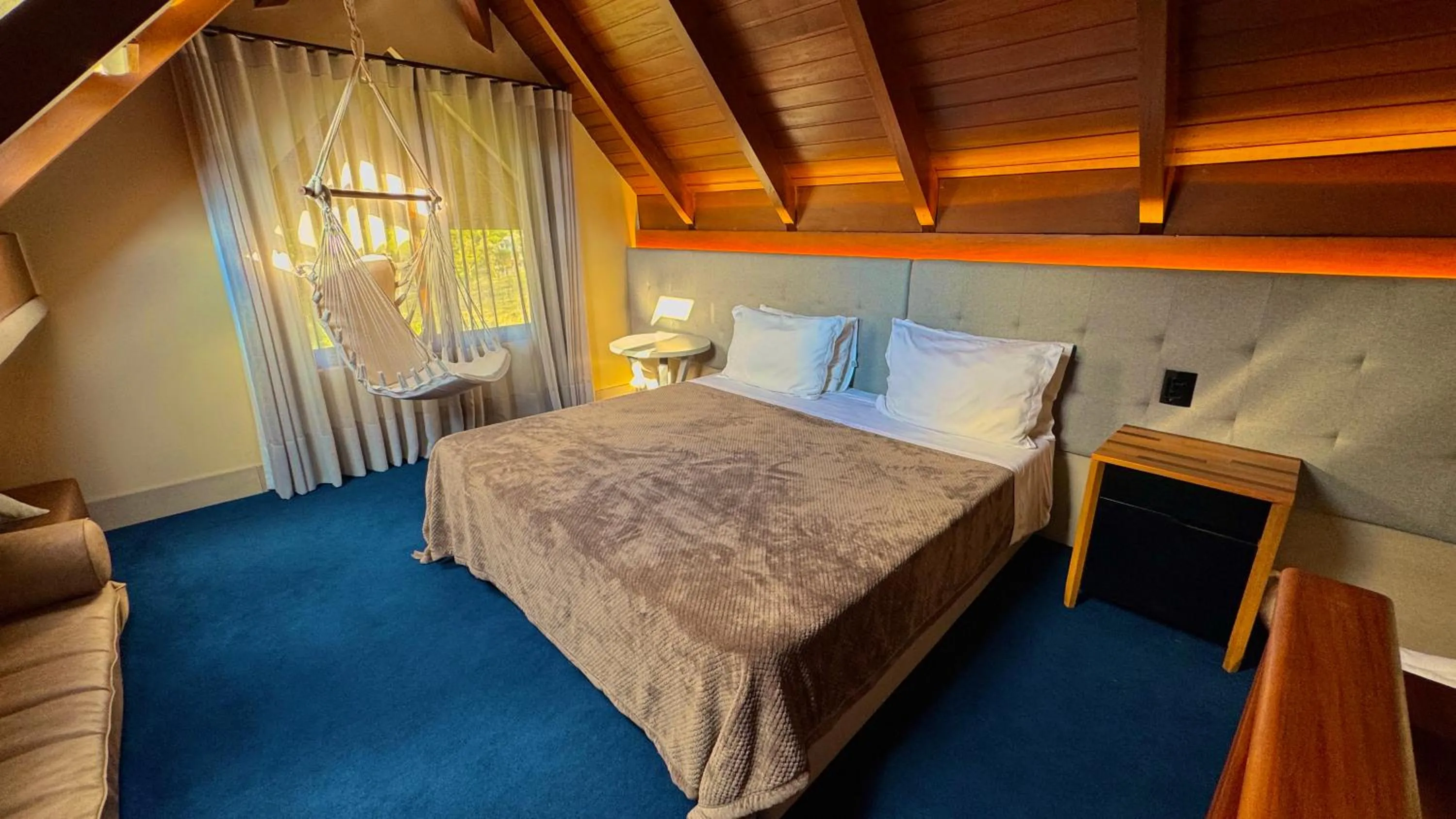 Bed in WoodStone Hotel Fazenda