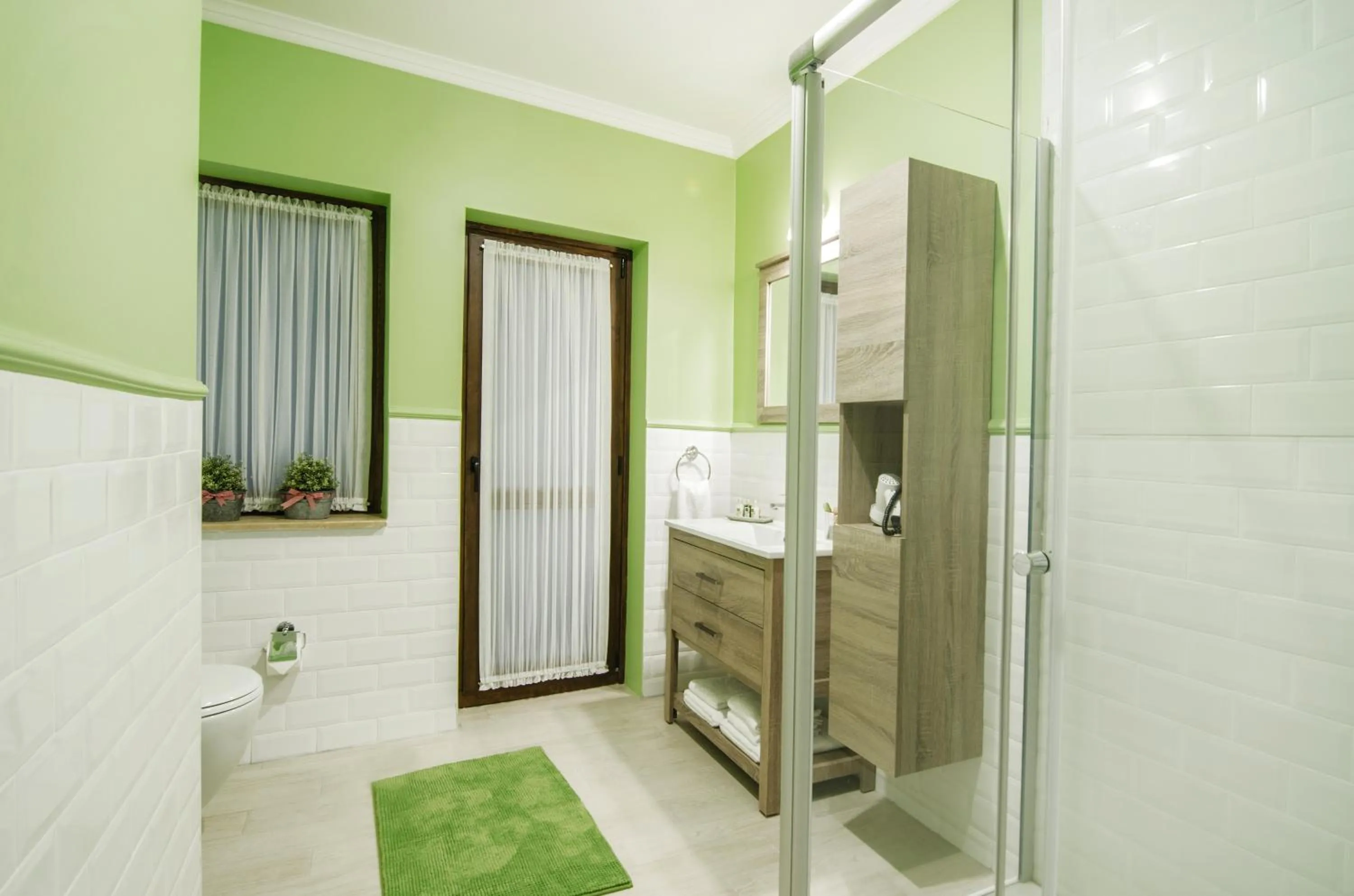 Bathroom, Bed in Rodina Suites Hotel