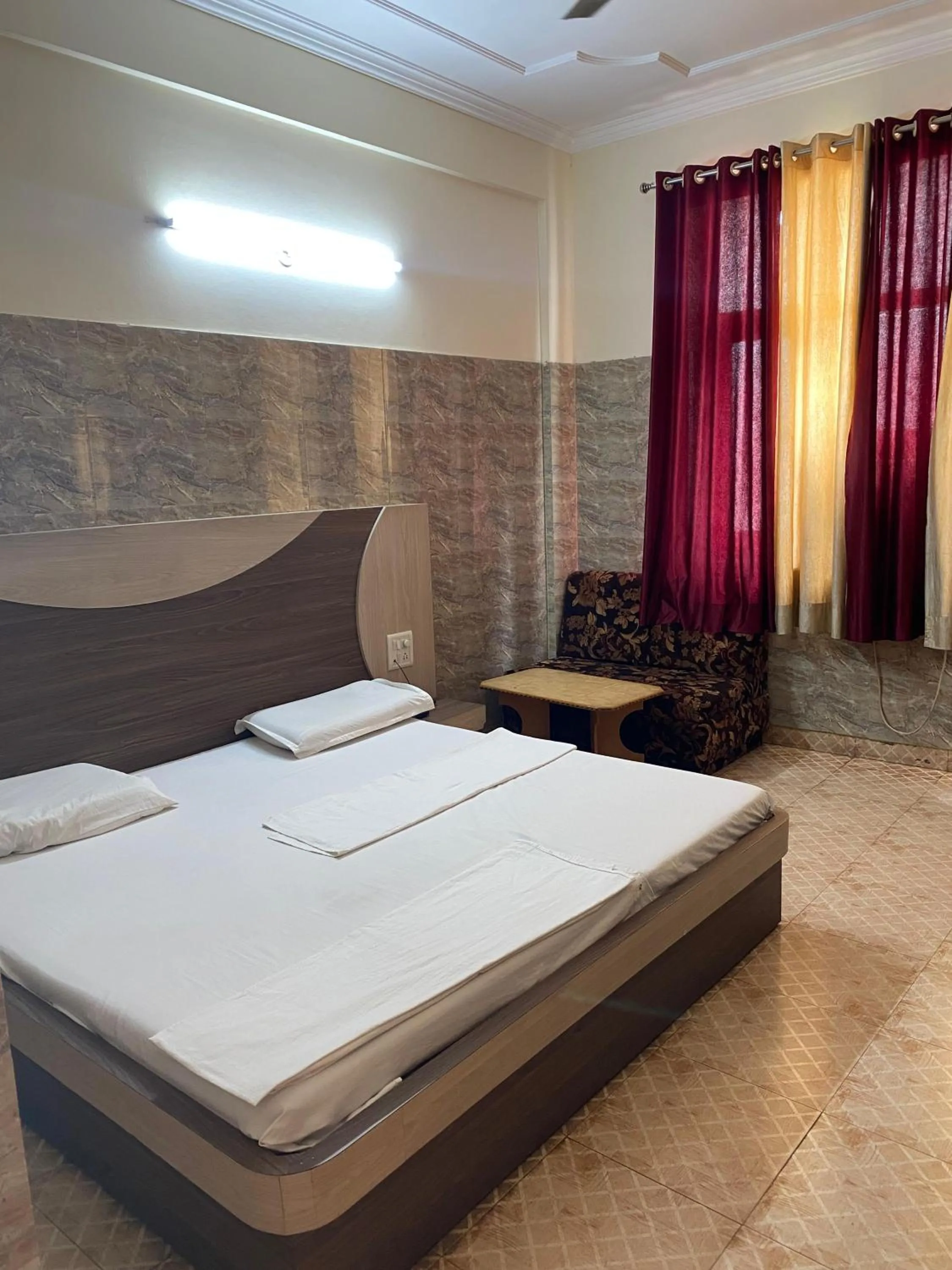 Bed in AASHIRWAD HOTEL