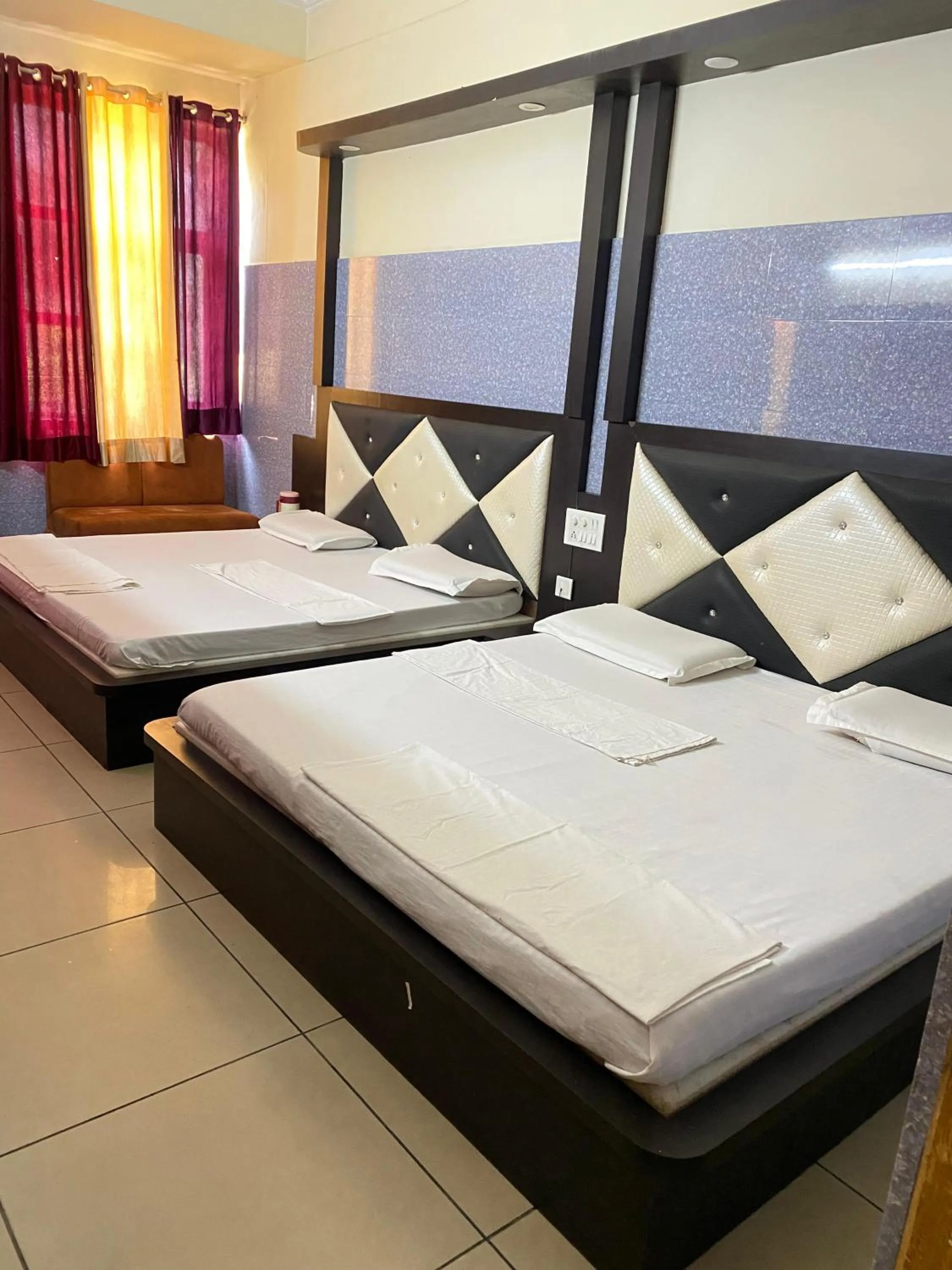 Bed in AASHIRWAD HOTEL