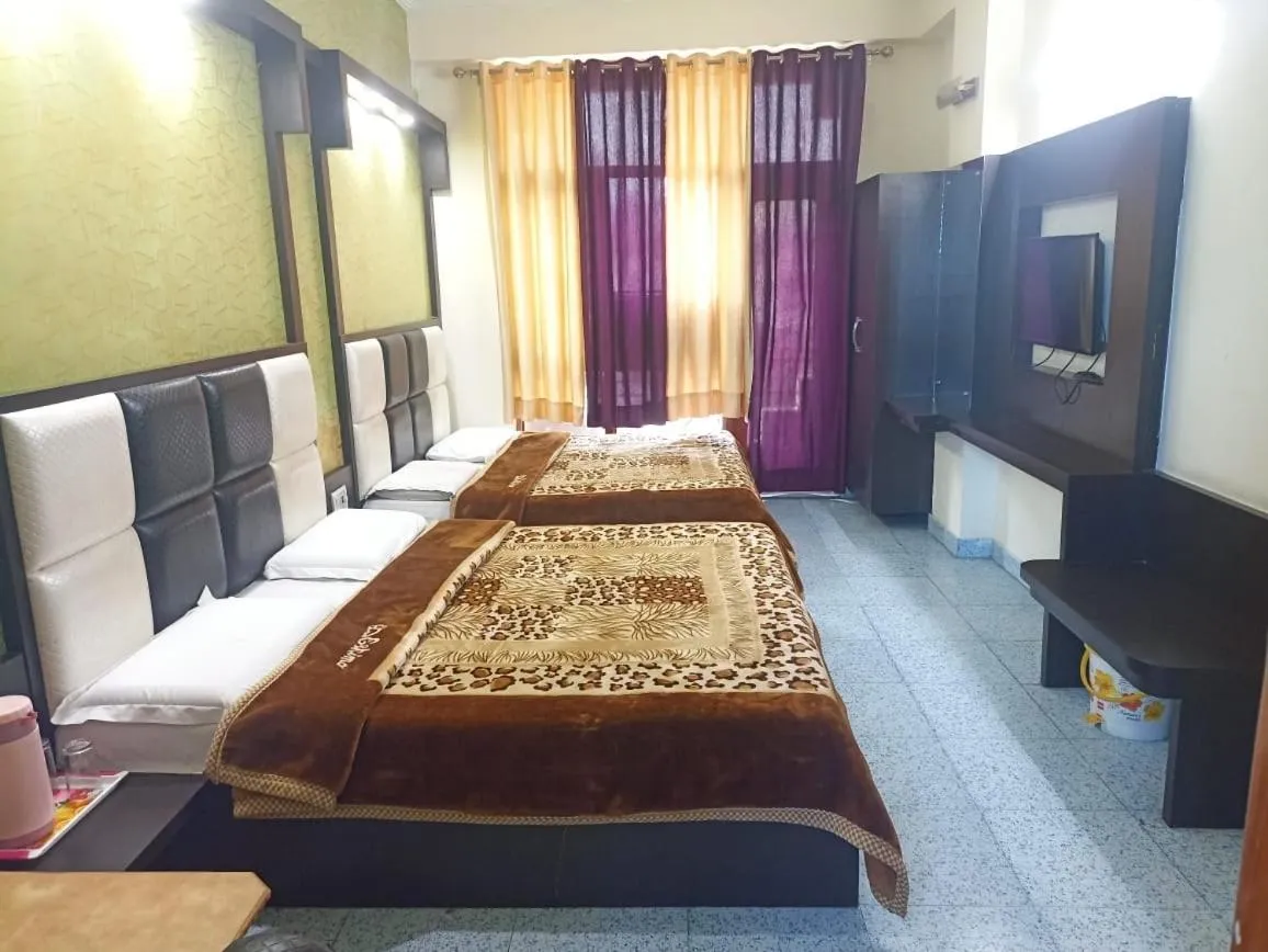 Bed in AASHIRWAD HOTEL