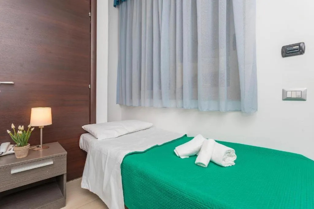 Bed in Sirina House Taormina