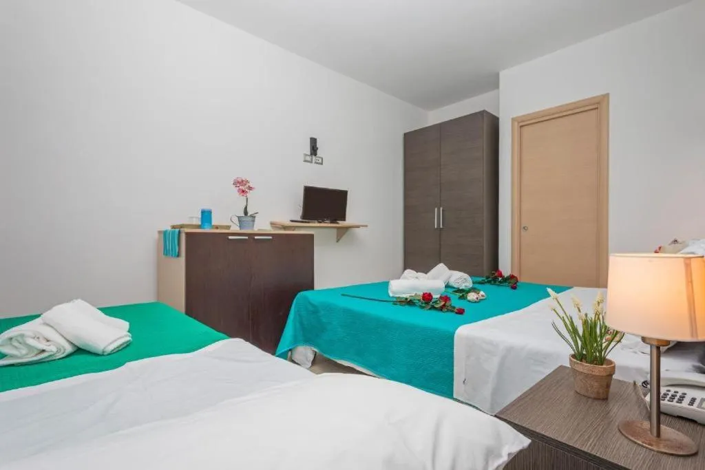 Bed in Sirina House Taormina