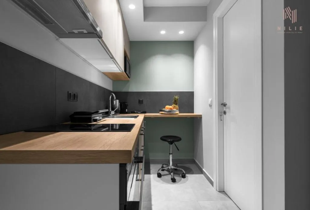 Kitchen or kitchenette in Big Apple, Nilie Hospitality MGMT