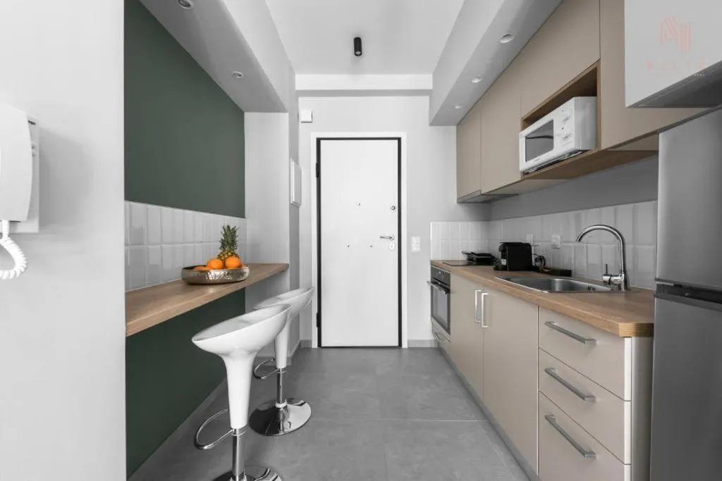 Kitchen or kitchenette in Big Apple, Nilie Hospitality MGMT
