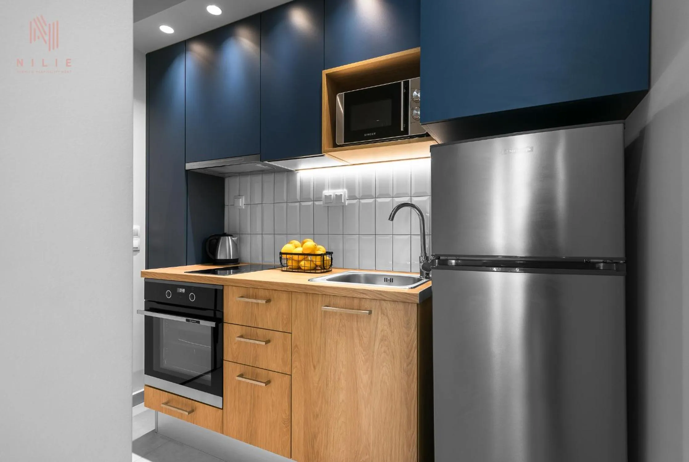 Kitchen or kitchenette in Big Apple, Nilie Hospitality MGMT
