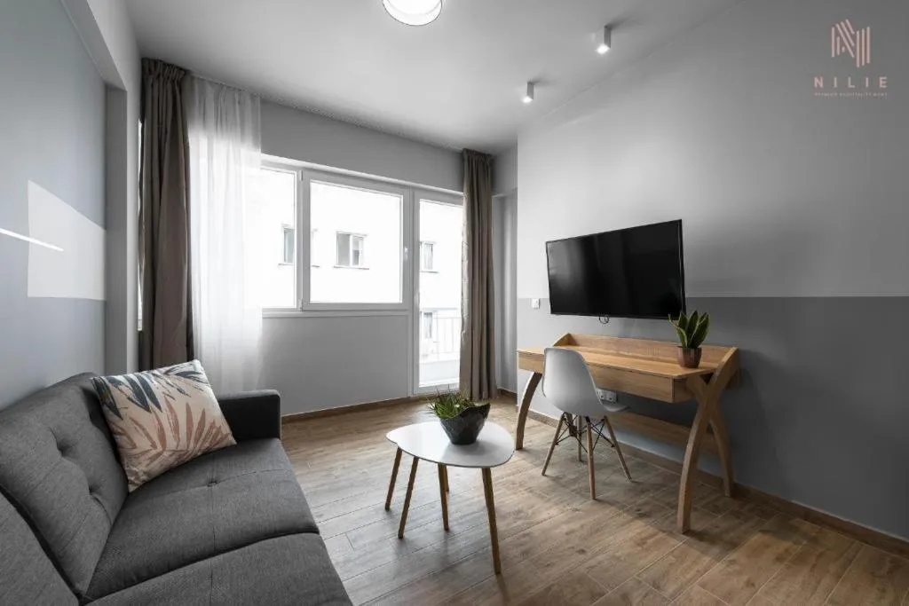 Communal lounge/ TV room in Big Apple, Nilie Hospitality MGMT