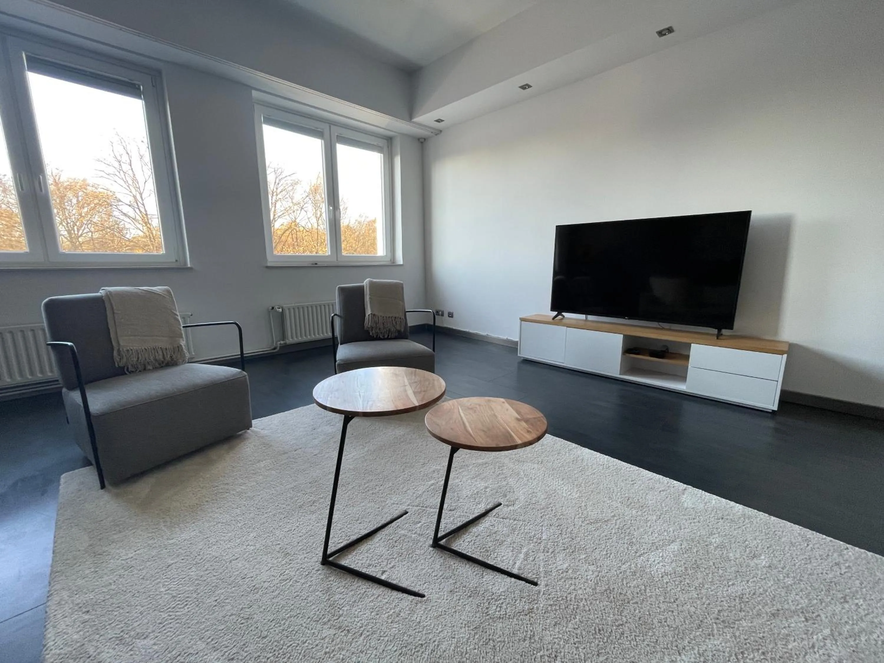 Communal lounge/ TV room in TruRetreats Design Loft für 8 Personen I Riesige Küche I eCharger I 65z SmartTV I 150qm