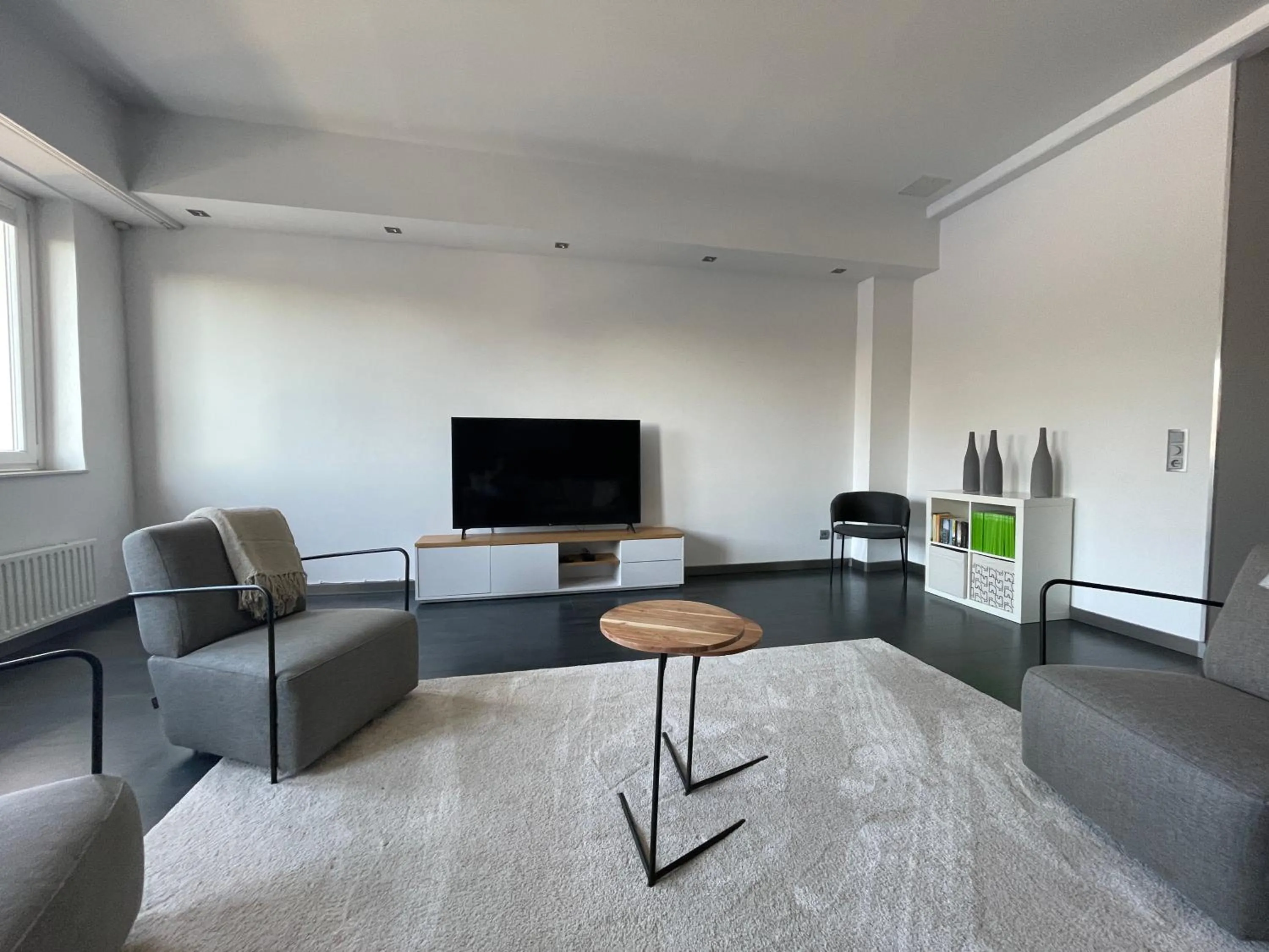 Communal lounge/ TV room in TruRetreats Design Loft für 8 Personen I Riesige Küche I eCharger I 65z SmartTV I 150qm