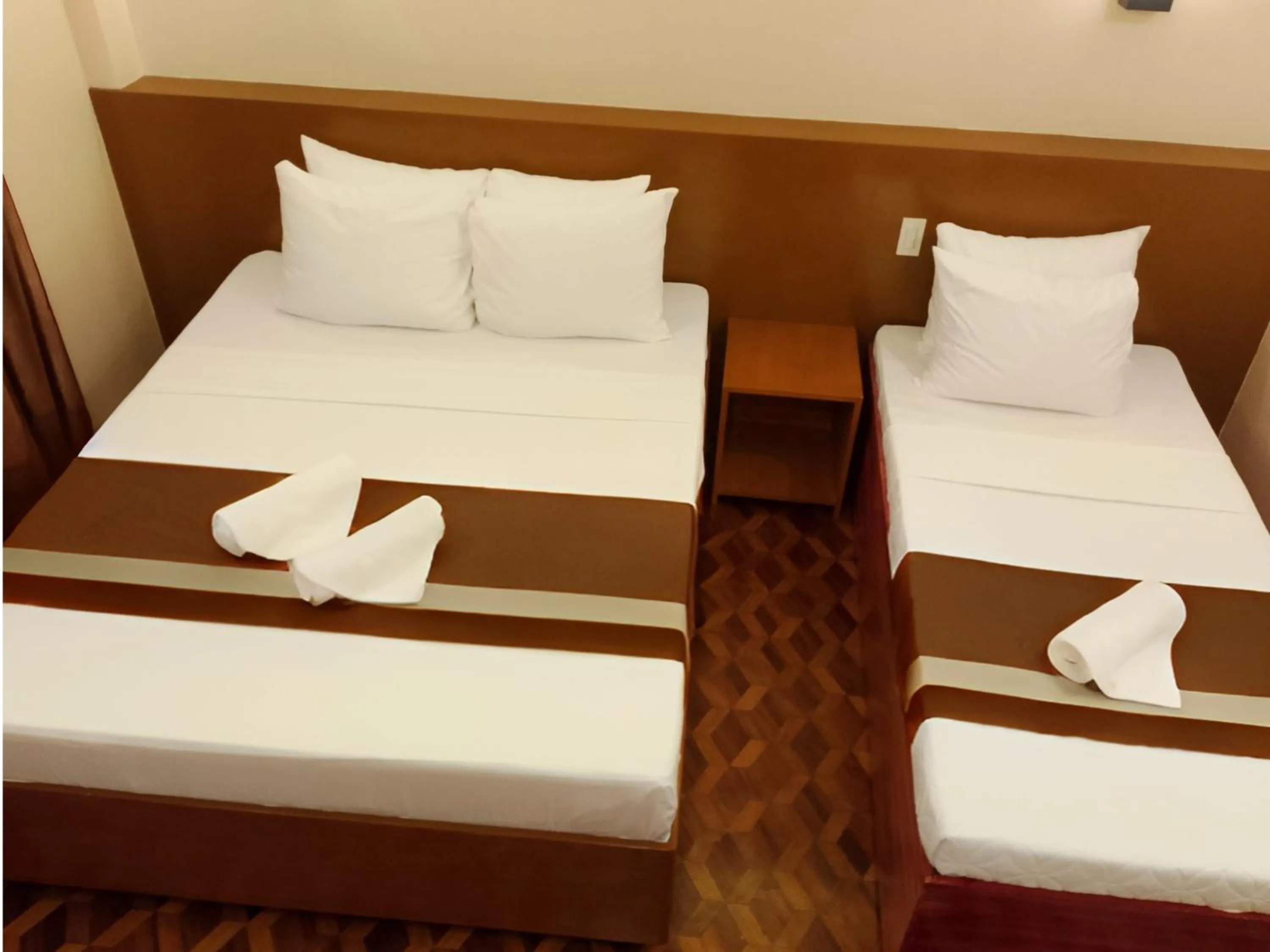 Bed in Dy Heritage Suites