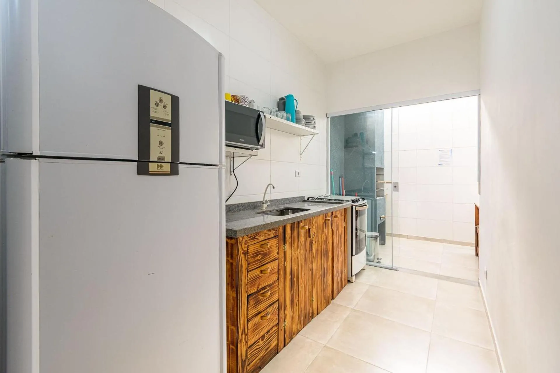 Kitchen or kitchenette in Apto com churrasqueira elétrica próximo à praia