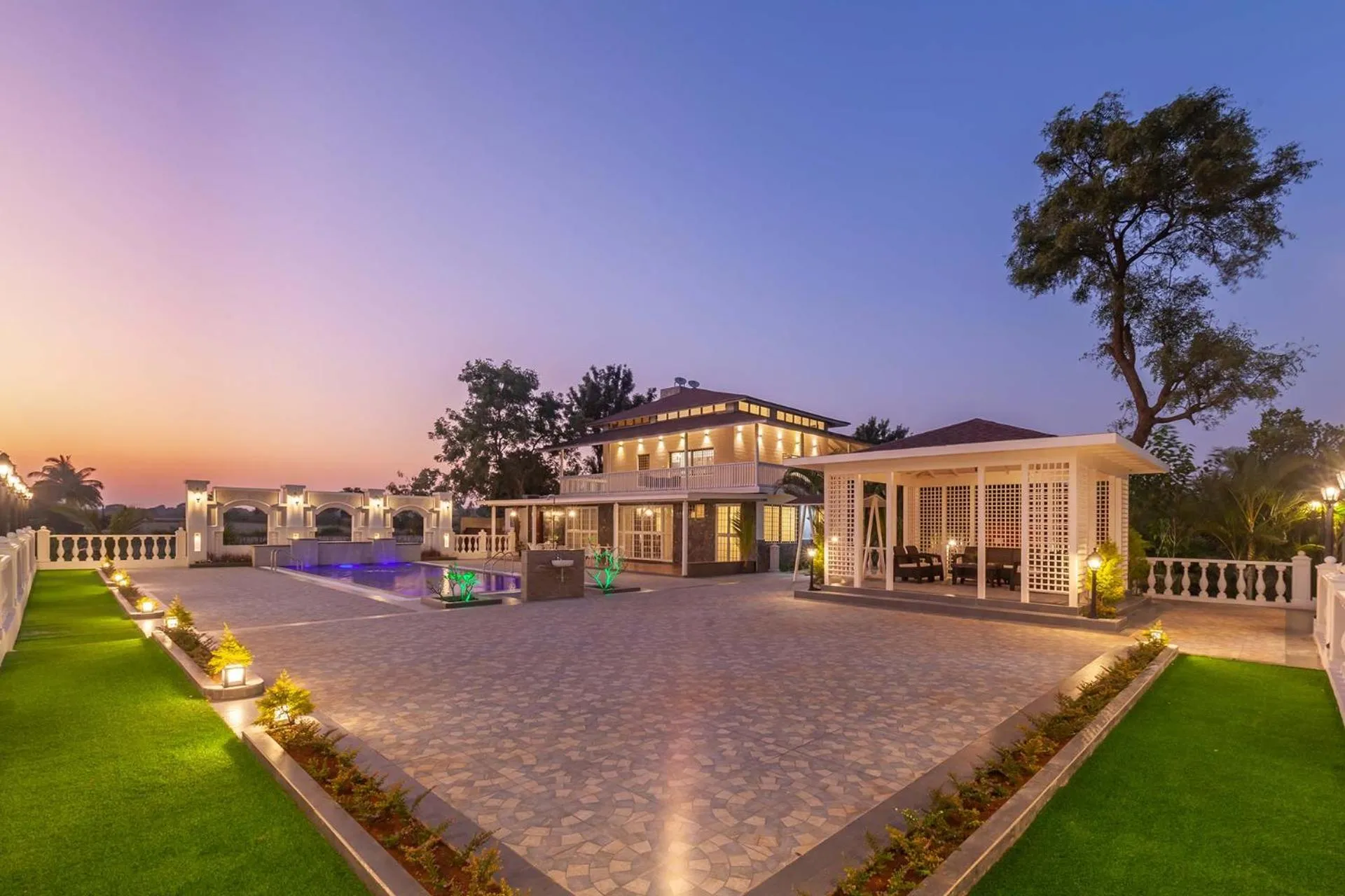 Property building in StayVista's Lake La Vie - Tranquil Lake-View Villa Amidst Farmland with Pool and Poolside Gazebo - Proximity to Sula