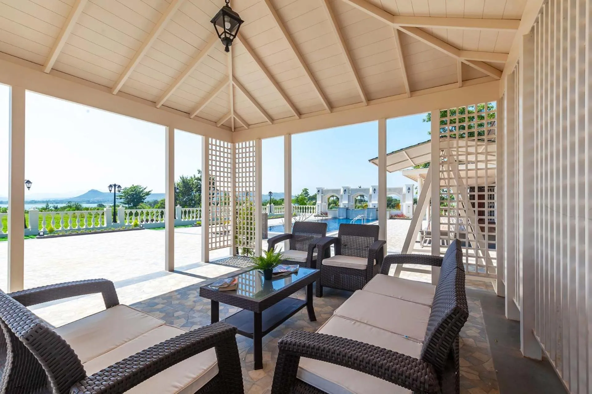 Seating area in StayVista's Lake La Vie - Tranquil Lake-View Villa Amidst Farmland with Pool and Poolside Gazebo - Proximity to Sula