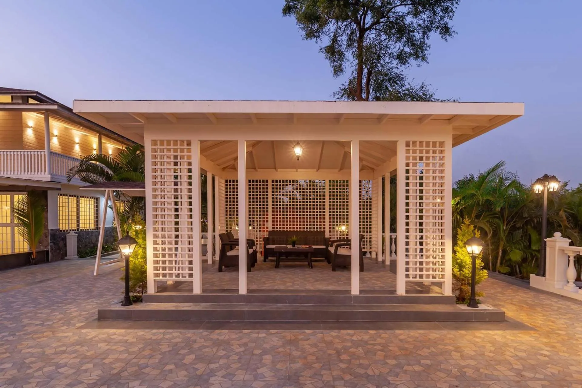 Patio in StayVista's Lake La Vie - Tranquil Lake-View Villa Amidst Farmland with Pool and Poolside Gazebo - Proximity to Sula
