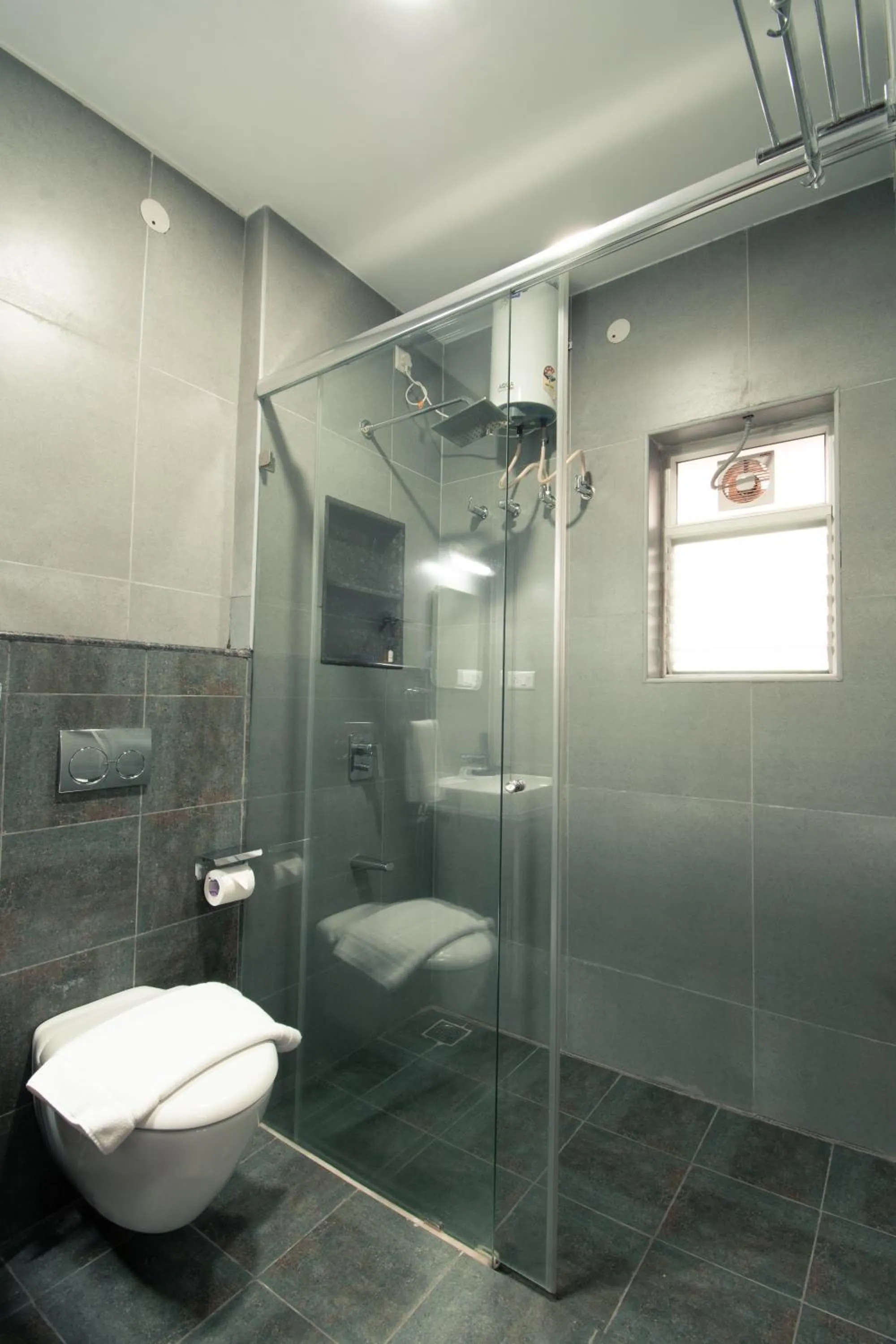 Toilet in Athulya Residence Suite Rooms