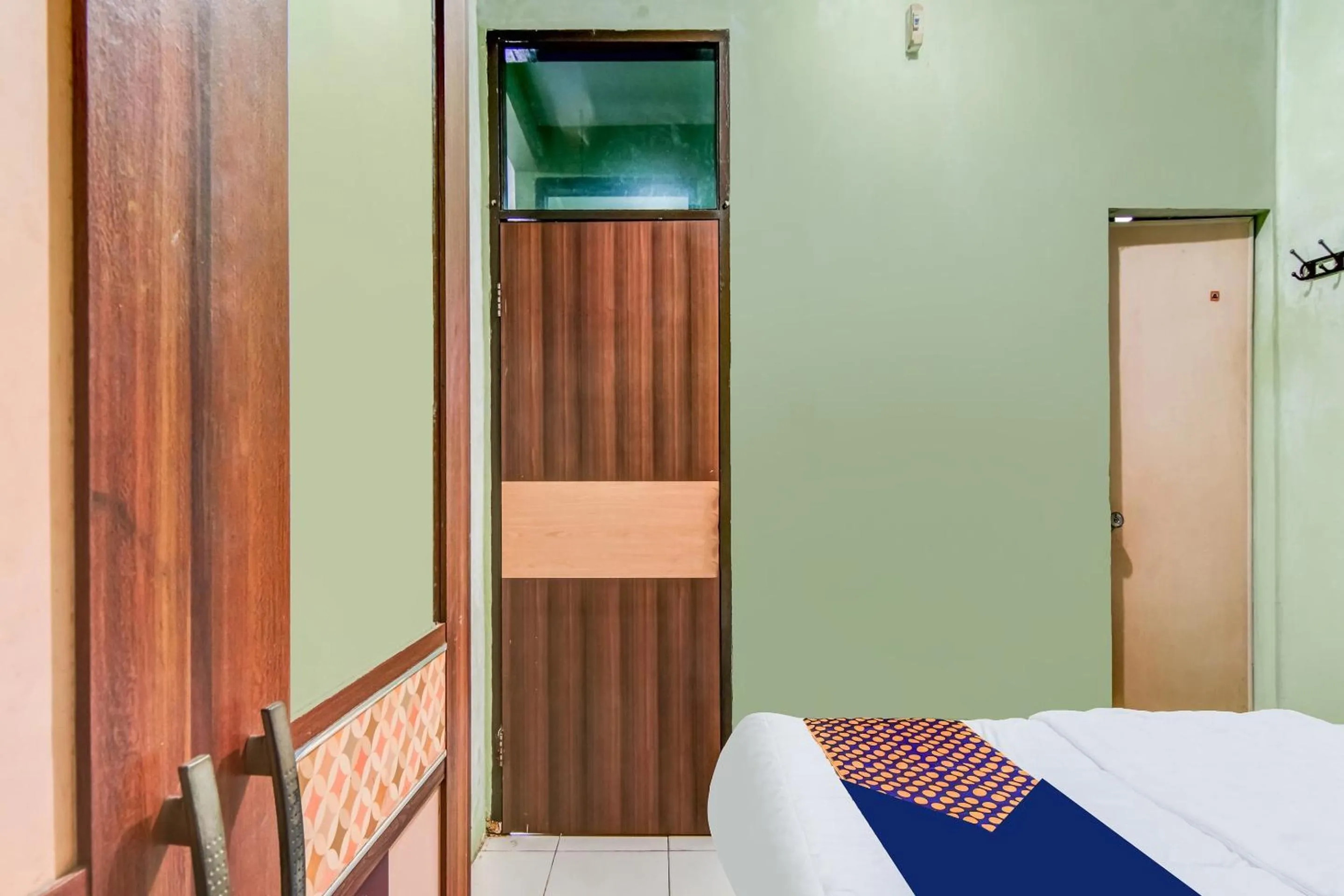 Bedroom, Bed in Hotel O Nayla Homestay Syariah Near Koro Koro Panam, Karaoke, Pool, & Cafe