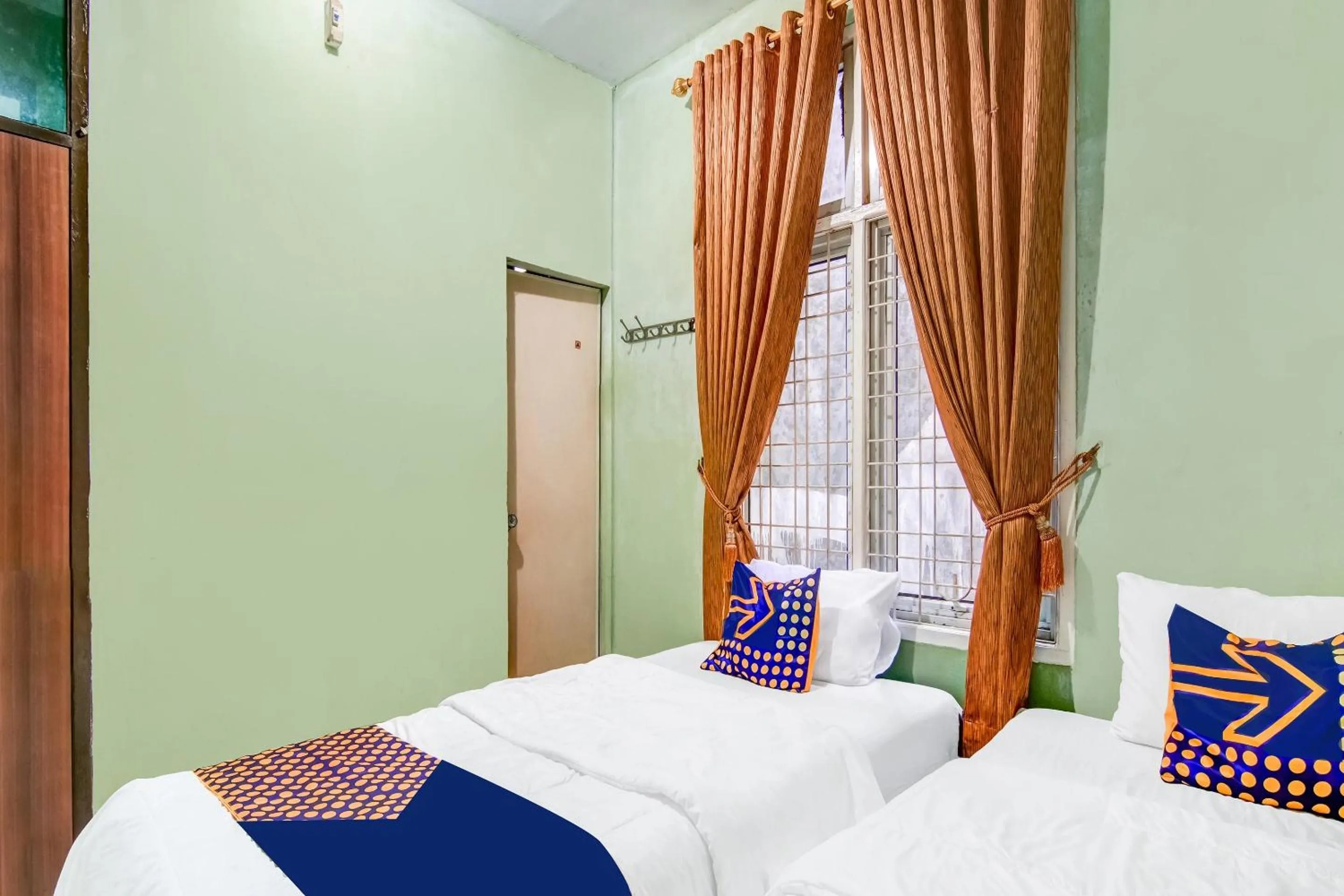 Bedroom, Bed in Hotel O Nayla Homestay Syariah Near Koro Koro Panam, Karaoke, Pool, & Cafe