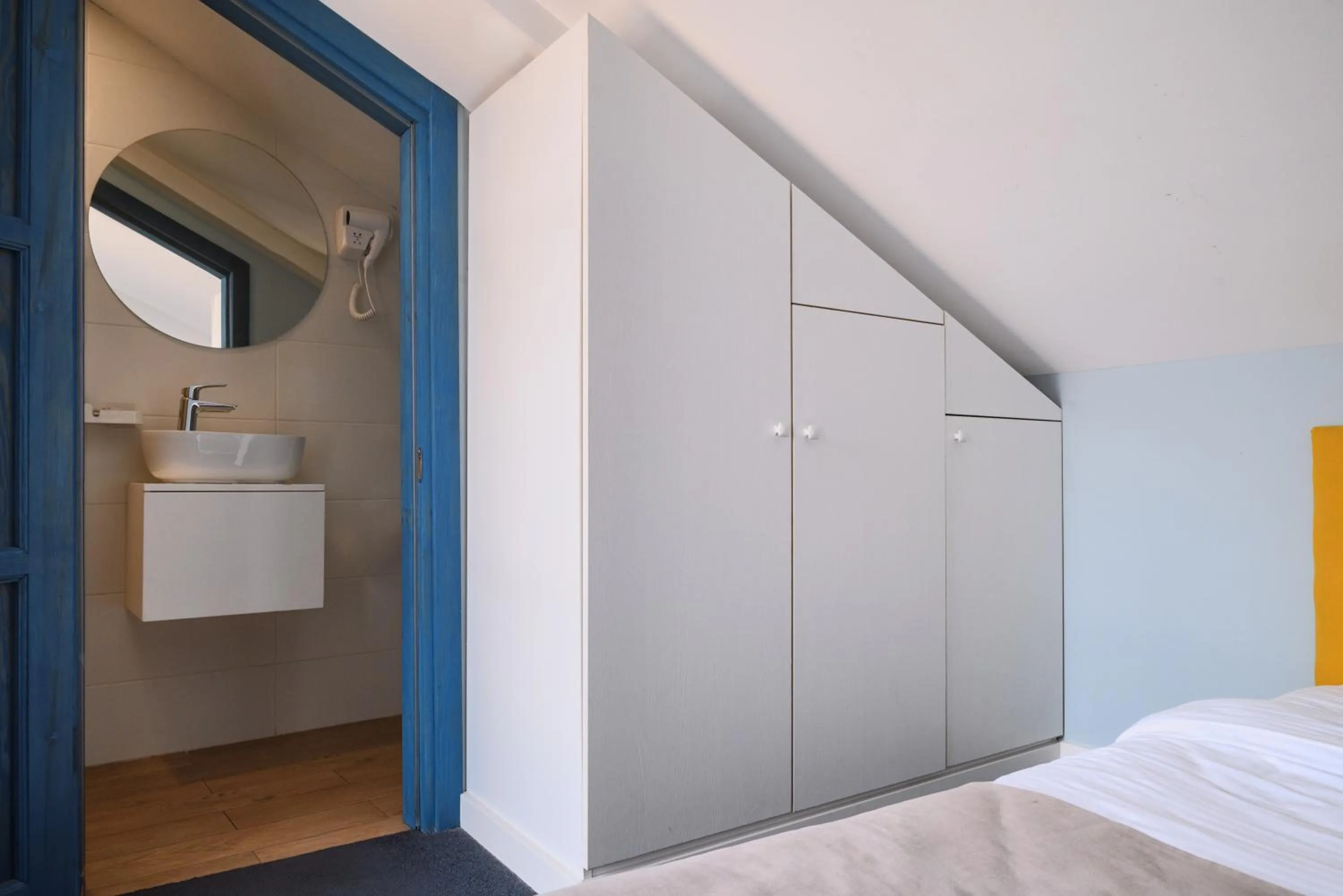 Bed in Blue Balcony Hotel