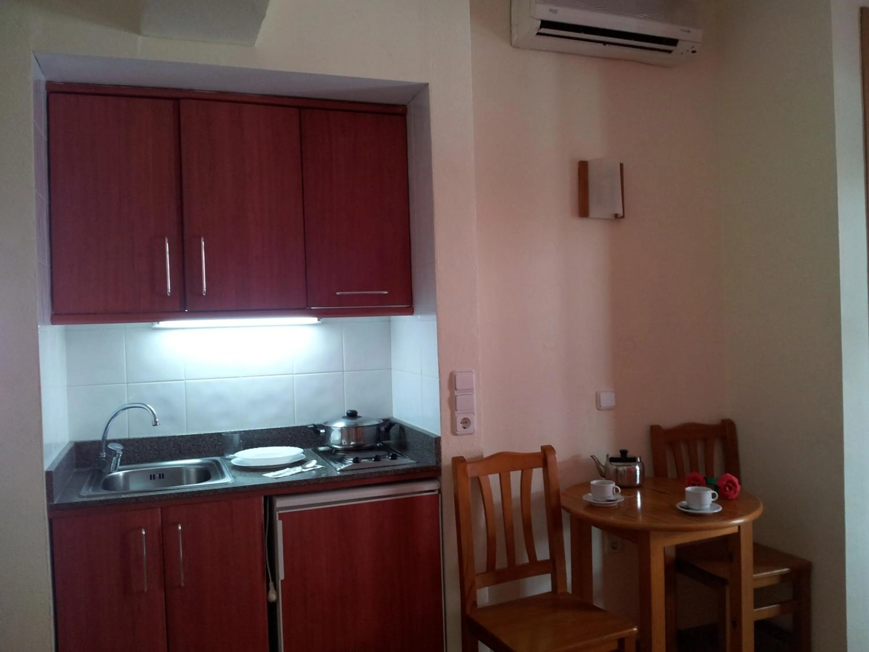 Kitchen or kitchenette in Apartamentos Casa Maria