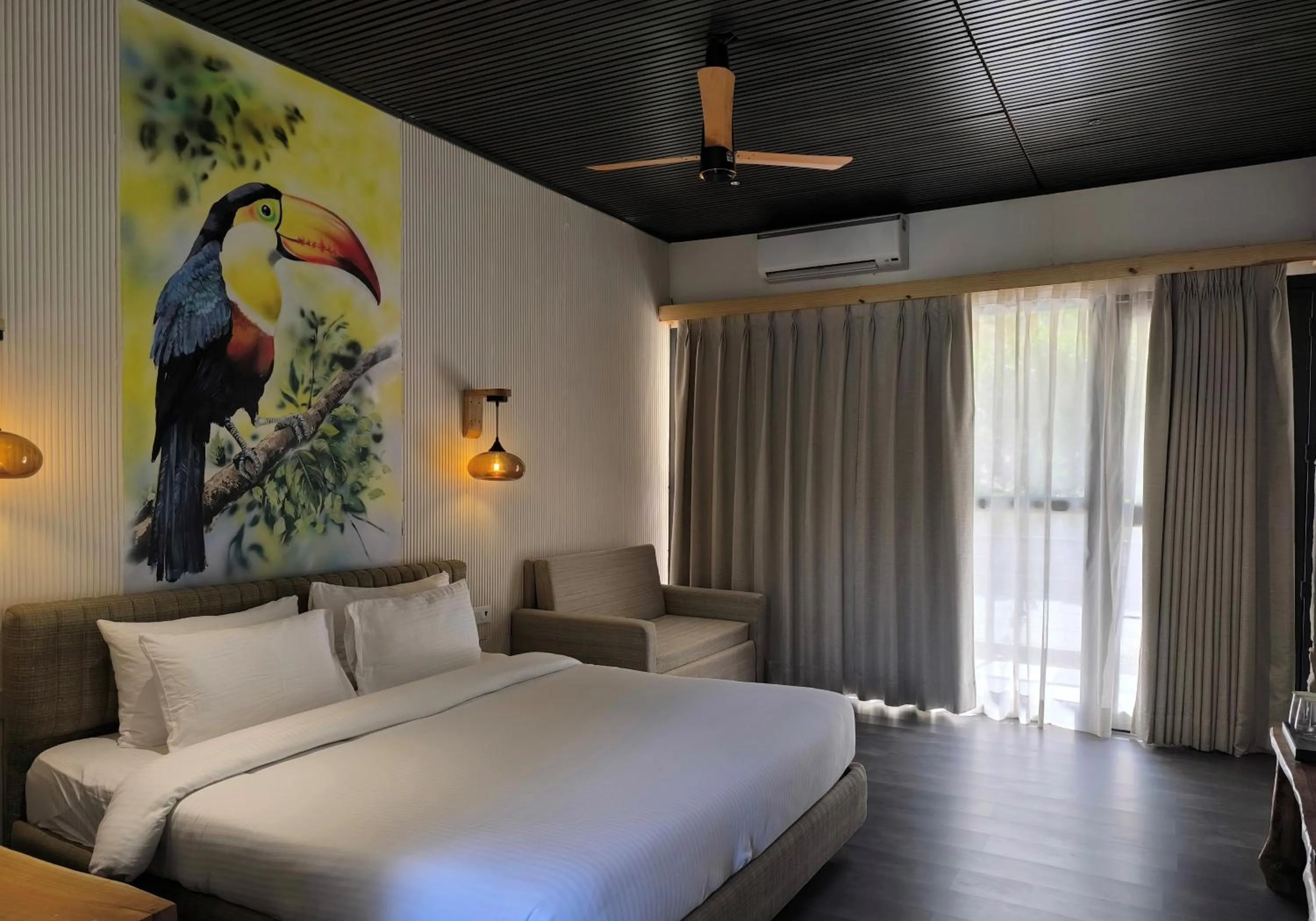 Bed in WelcomHeritage Tarangi Ramganga Resort