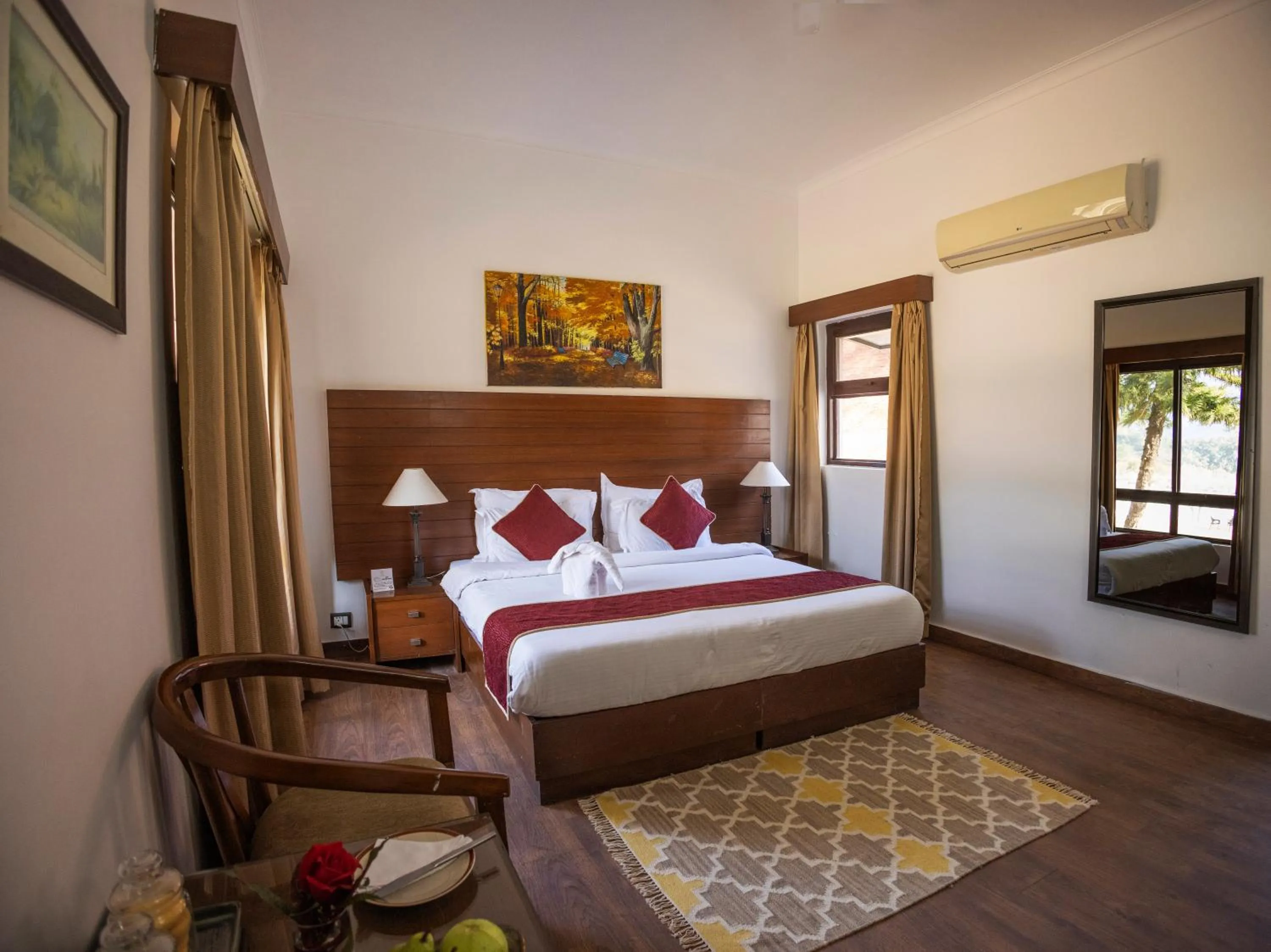 Bed in WelcomHeritage Tarangi Ramganga Resort