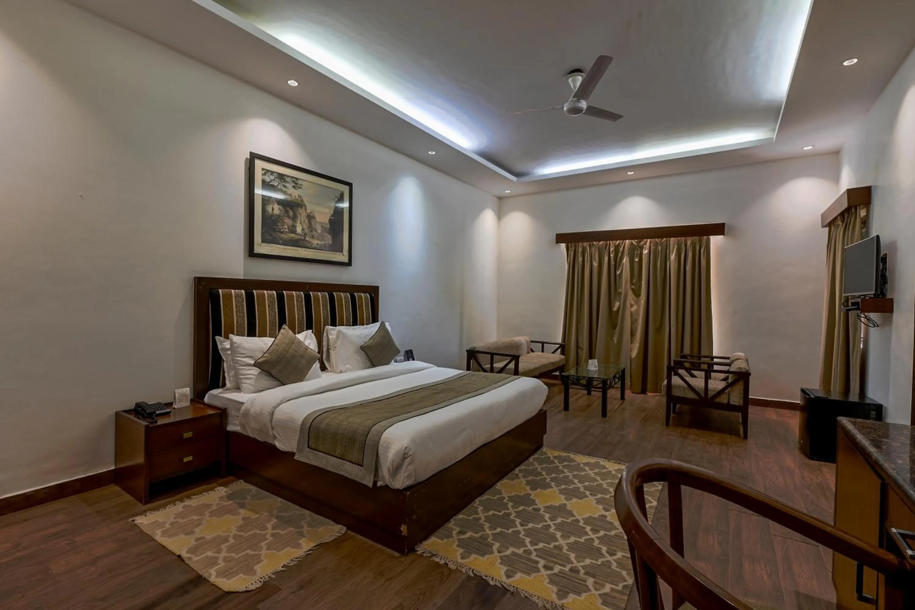 Bed in WelcomHeritage Tarangi Ramganga Resort