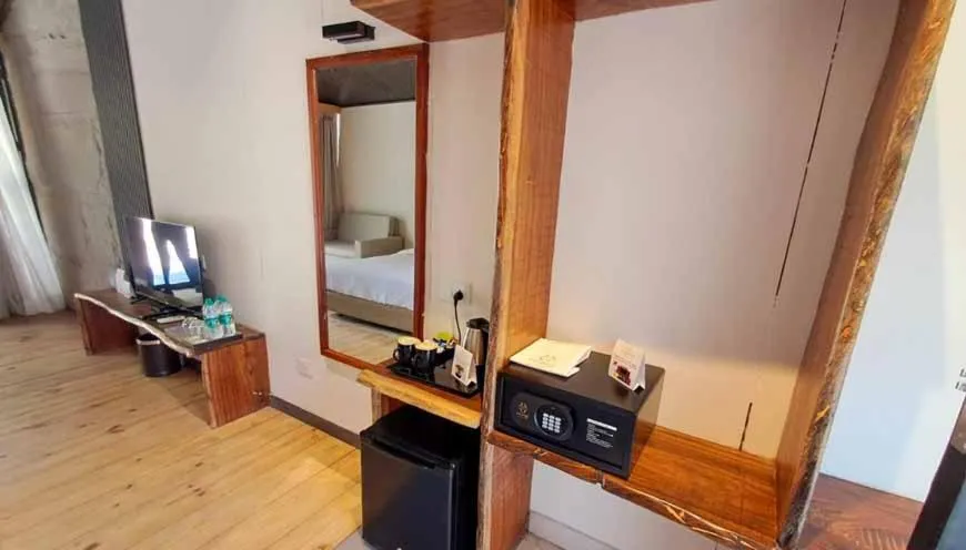 Bed in WelcomHeritage Tarangi Ramganga Resort