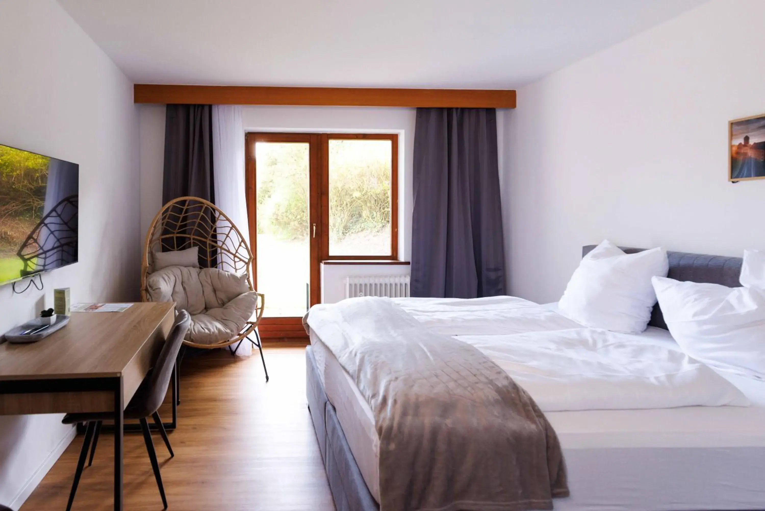 Bed in Naturhotel Blaubach Bed in Naturhotel Blaubach