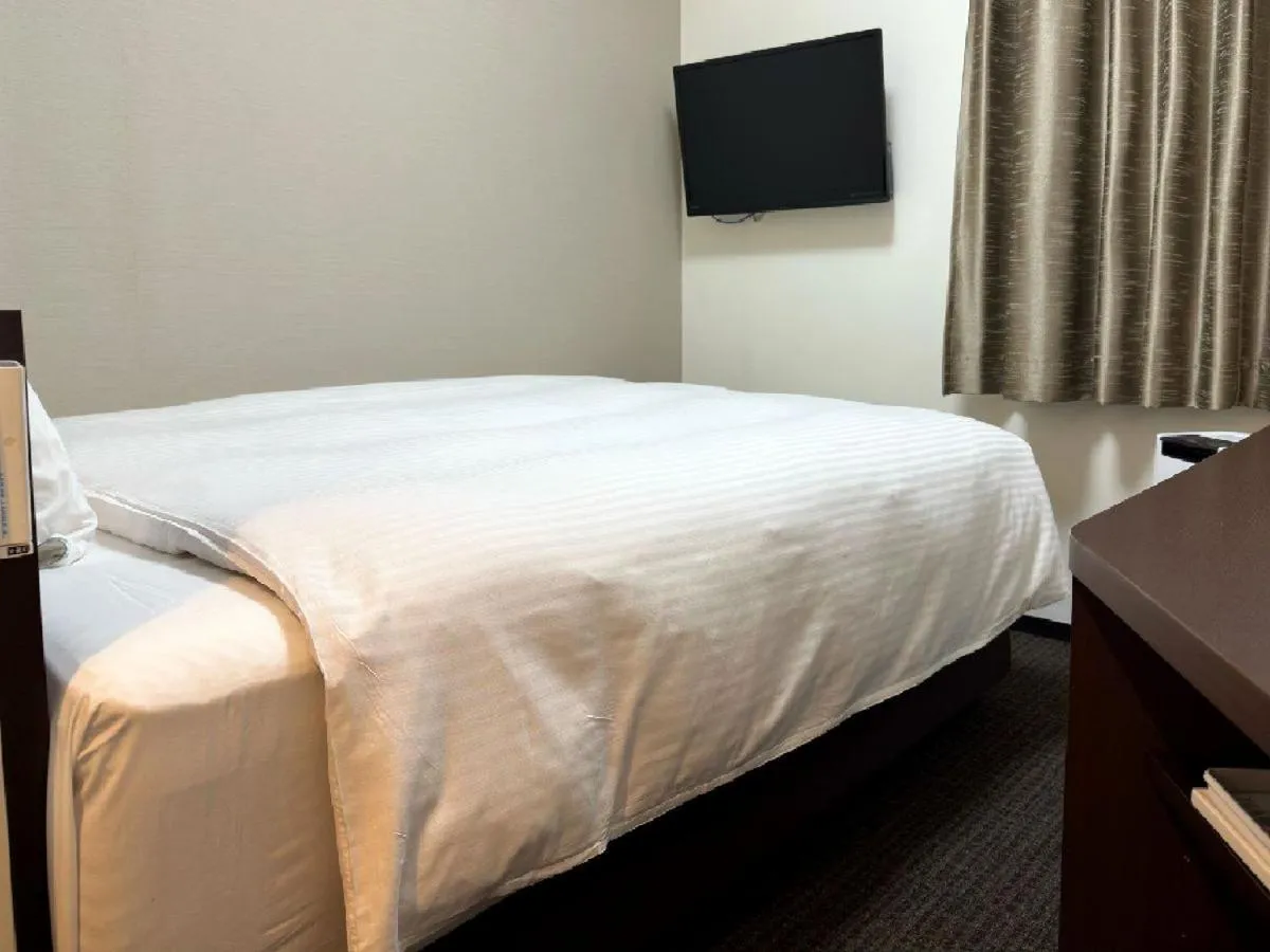 Bed in HOTEL GLAN Y's KUMAGAYAEKIMAE premier