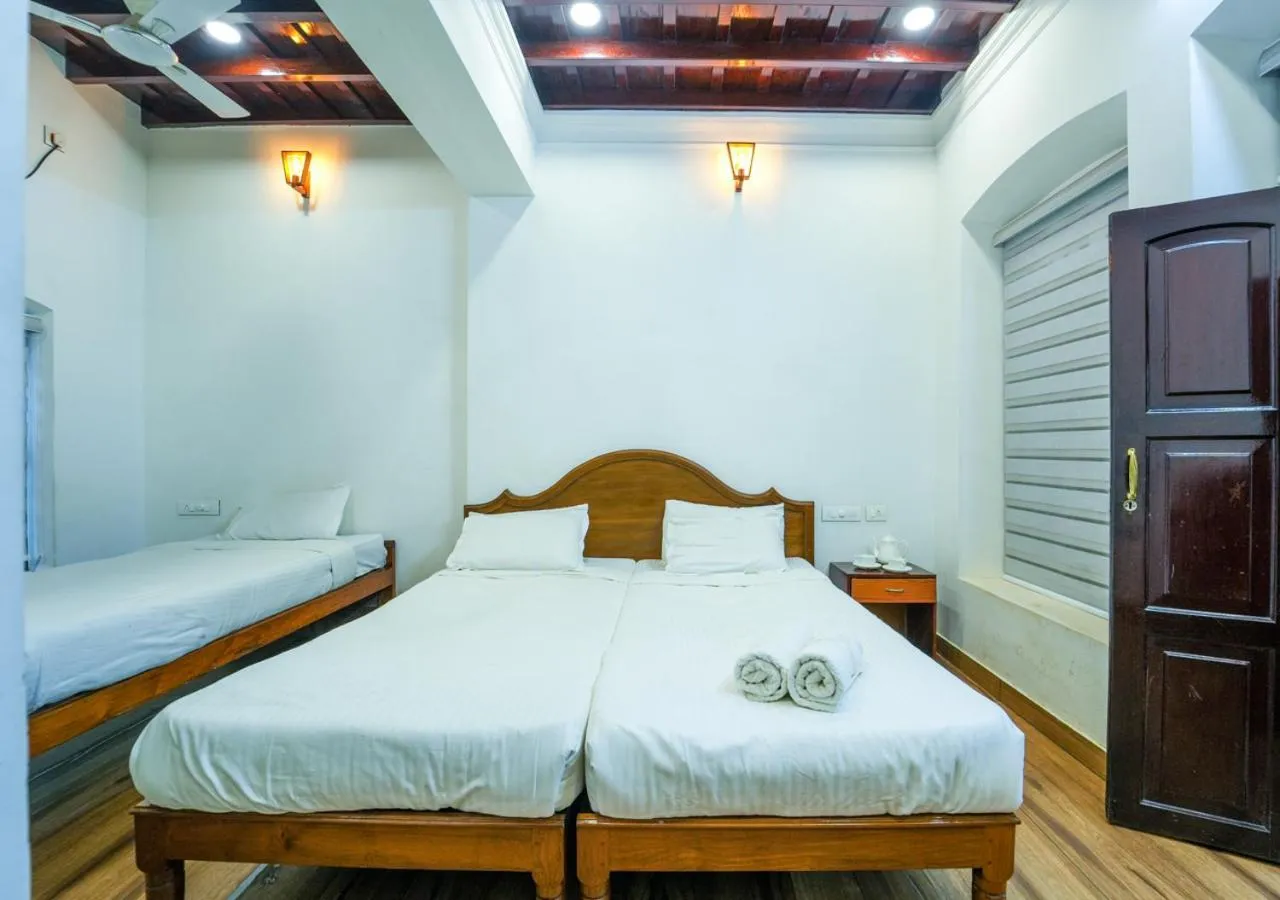 Photo of the whole room, Bed in Pop Tavern Kovalam Beach Villa by VOYE HOMES