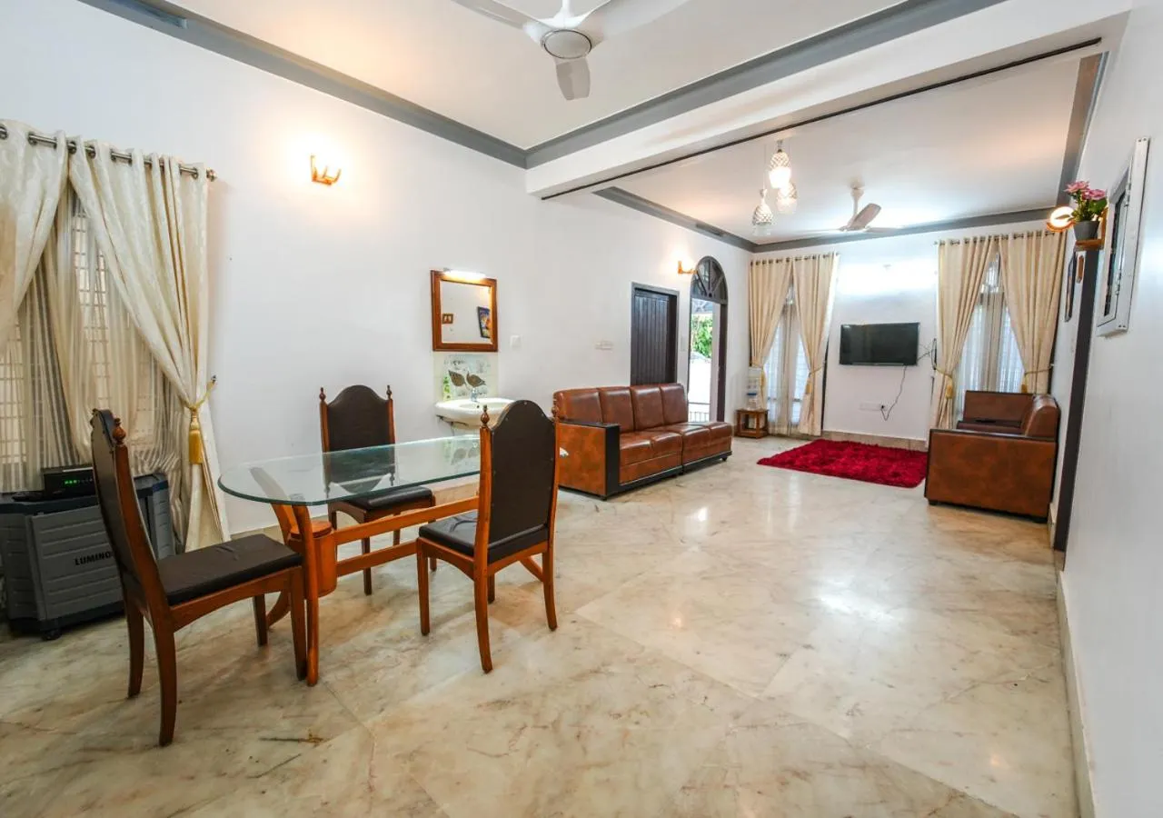 Living room in Pop Tavern Kovalam Beach Villa by VOYE HOMES